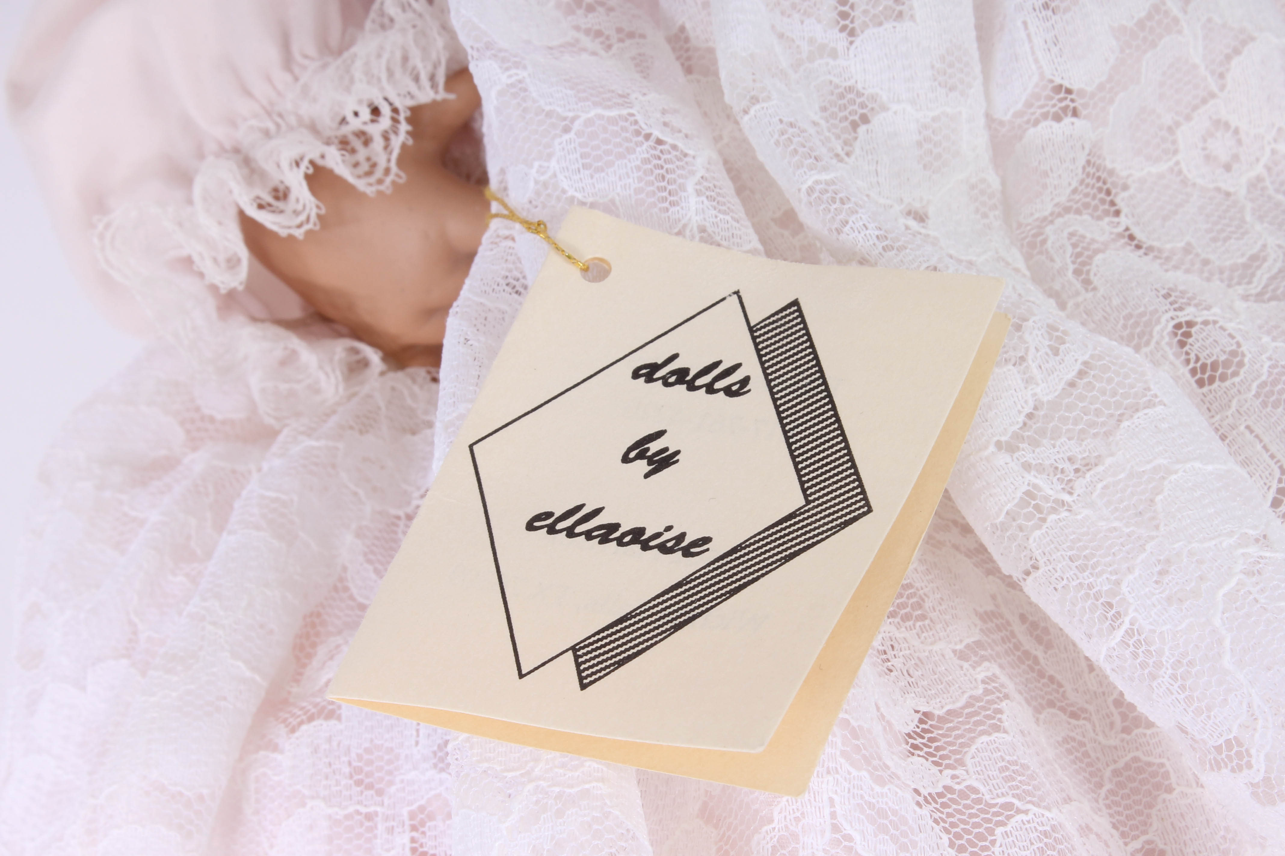 Handmade Porcelain Doll in Wicker Bassinet