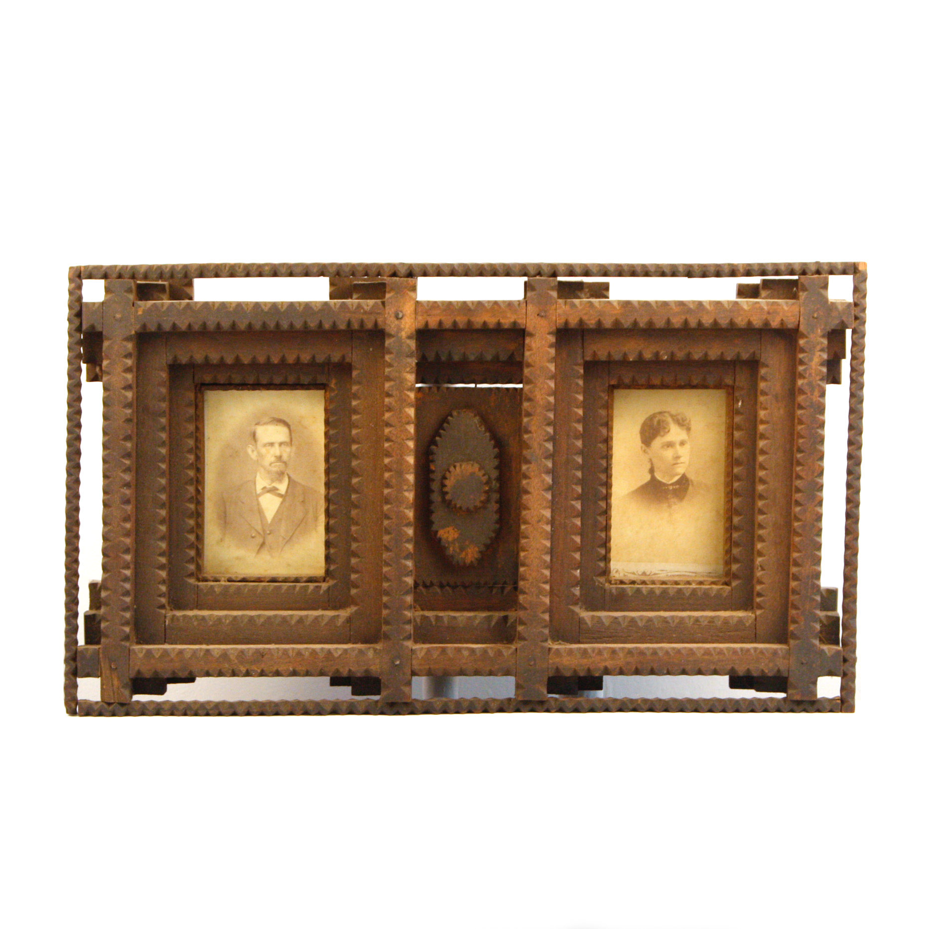Carved Tramp Art Frame with Pair of Antique Portraits