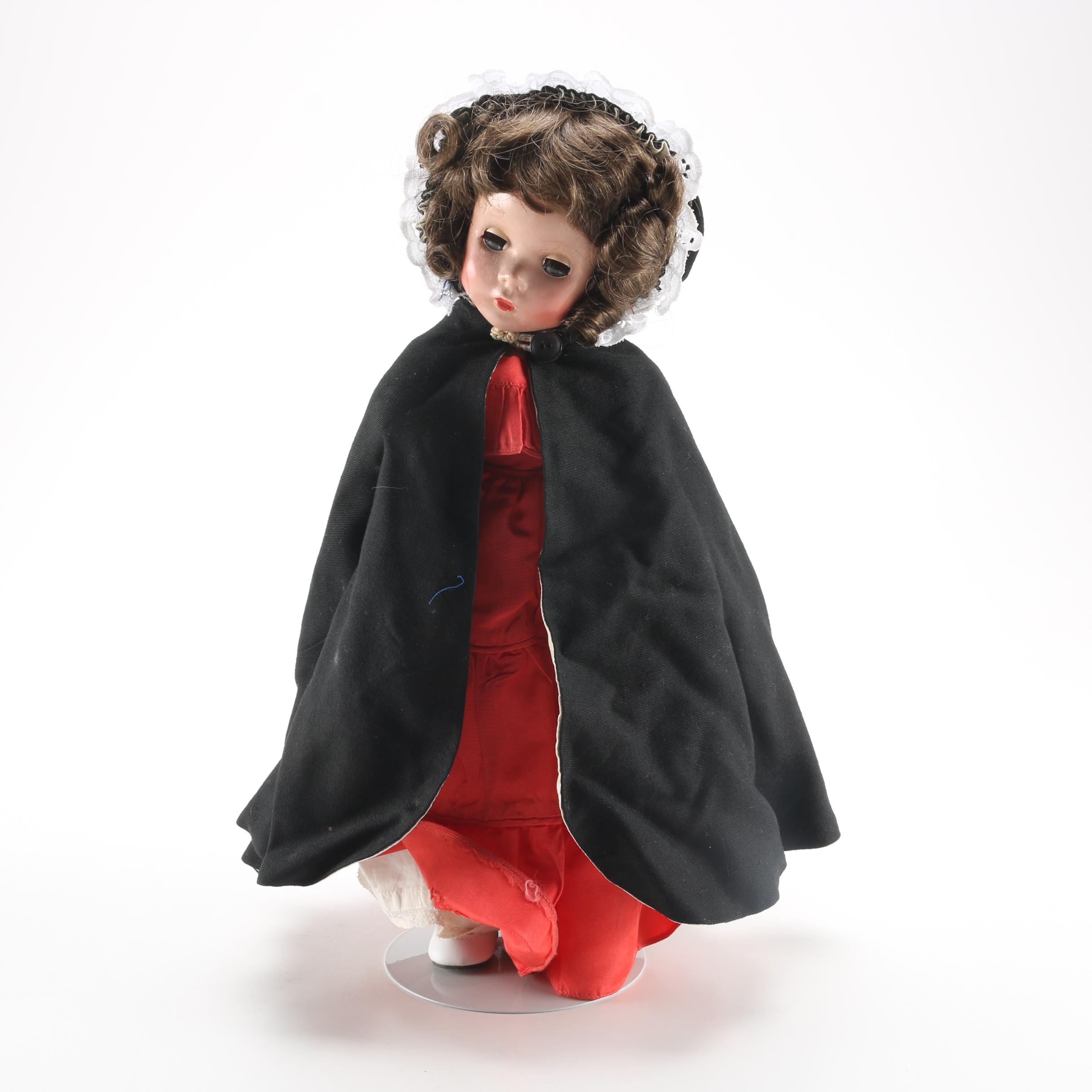 Porcelain Doll in Red Dress and Black Cloak