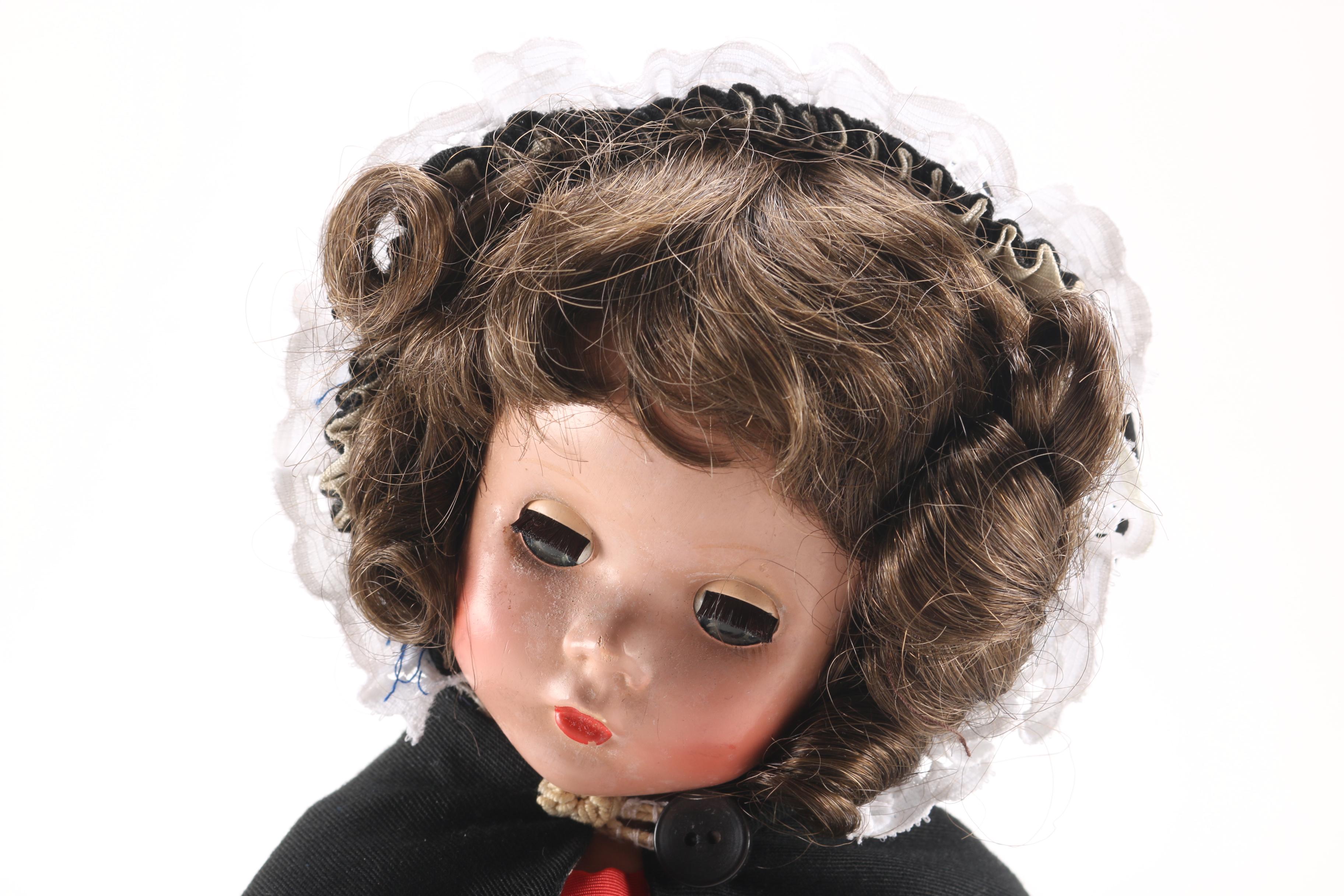 Porcelain Doll in Red Dress and Black Cloak
