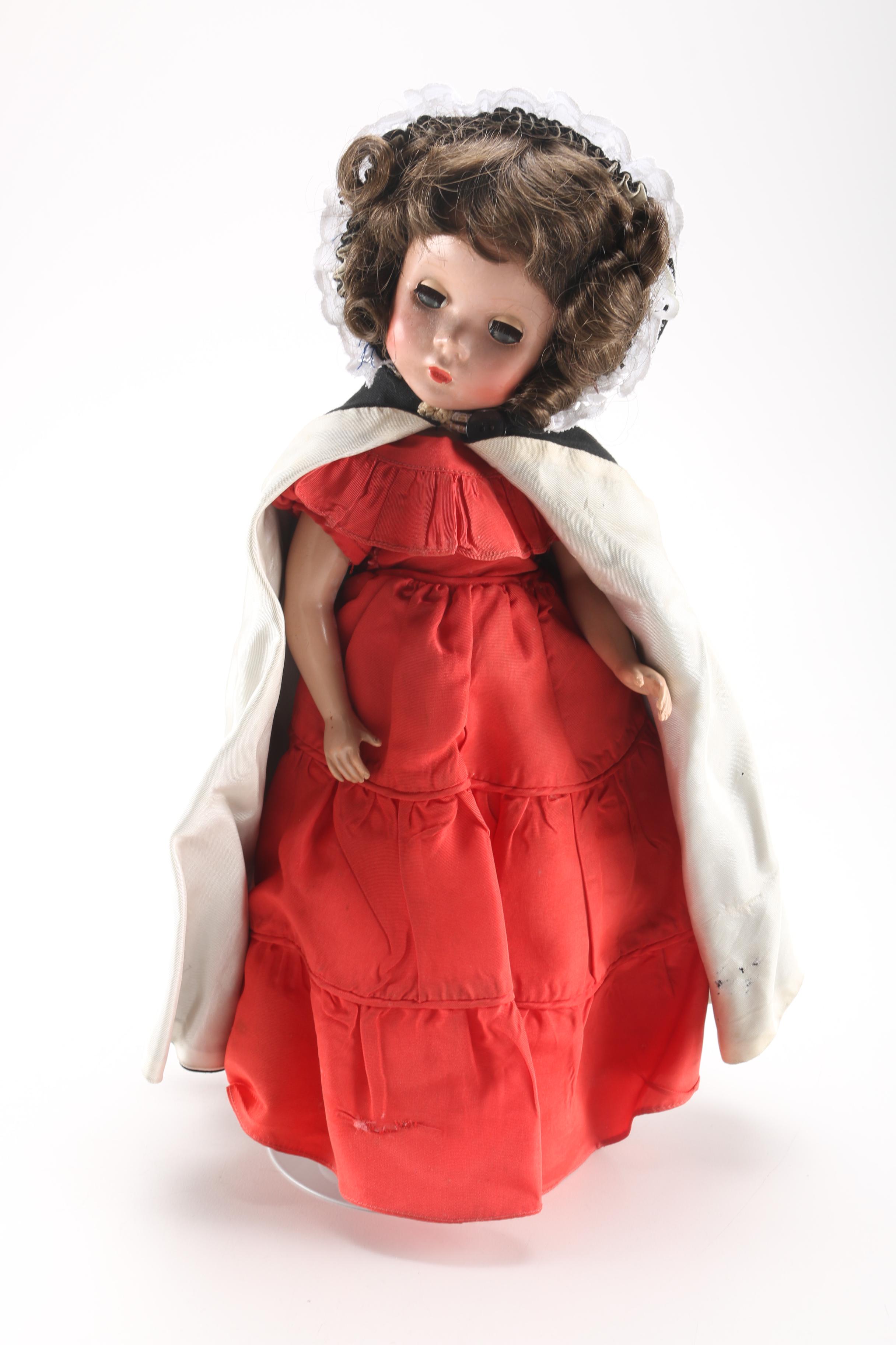 Porcelain Doll in Red Dress and Black Cloak