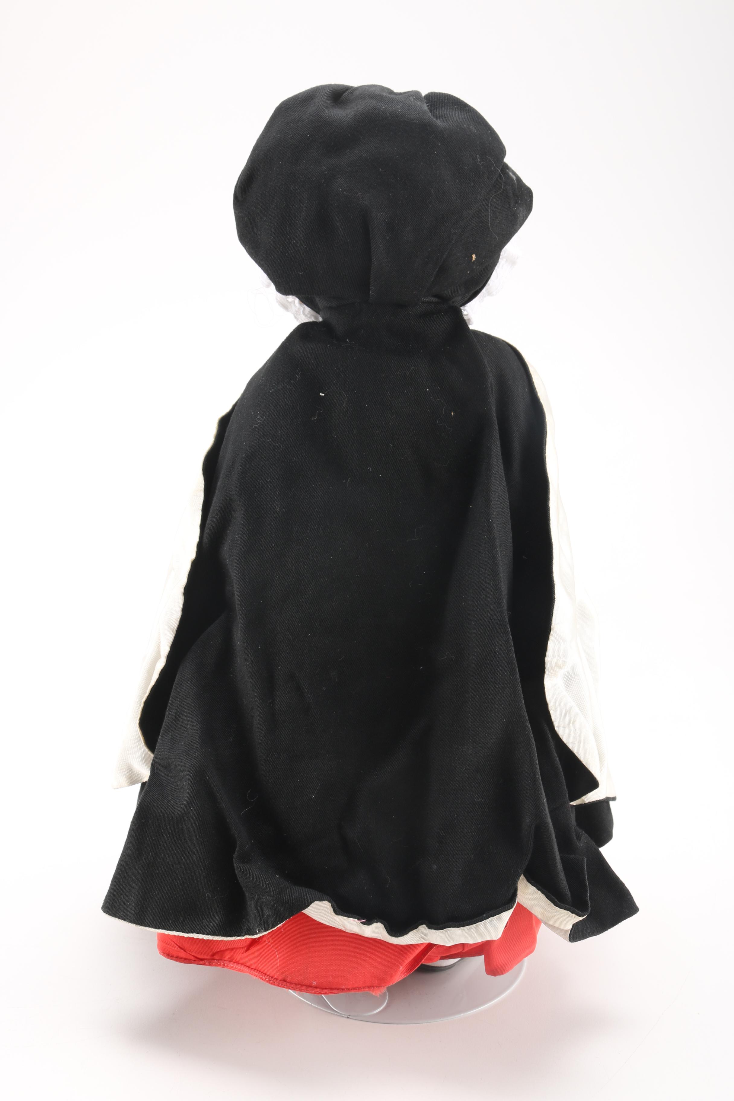 Porcelain Doll in Red Dress and Black Cloak