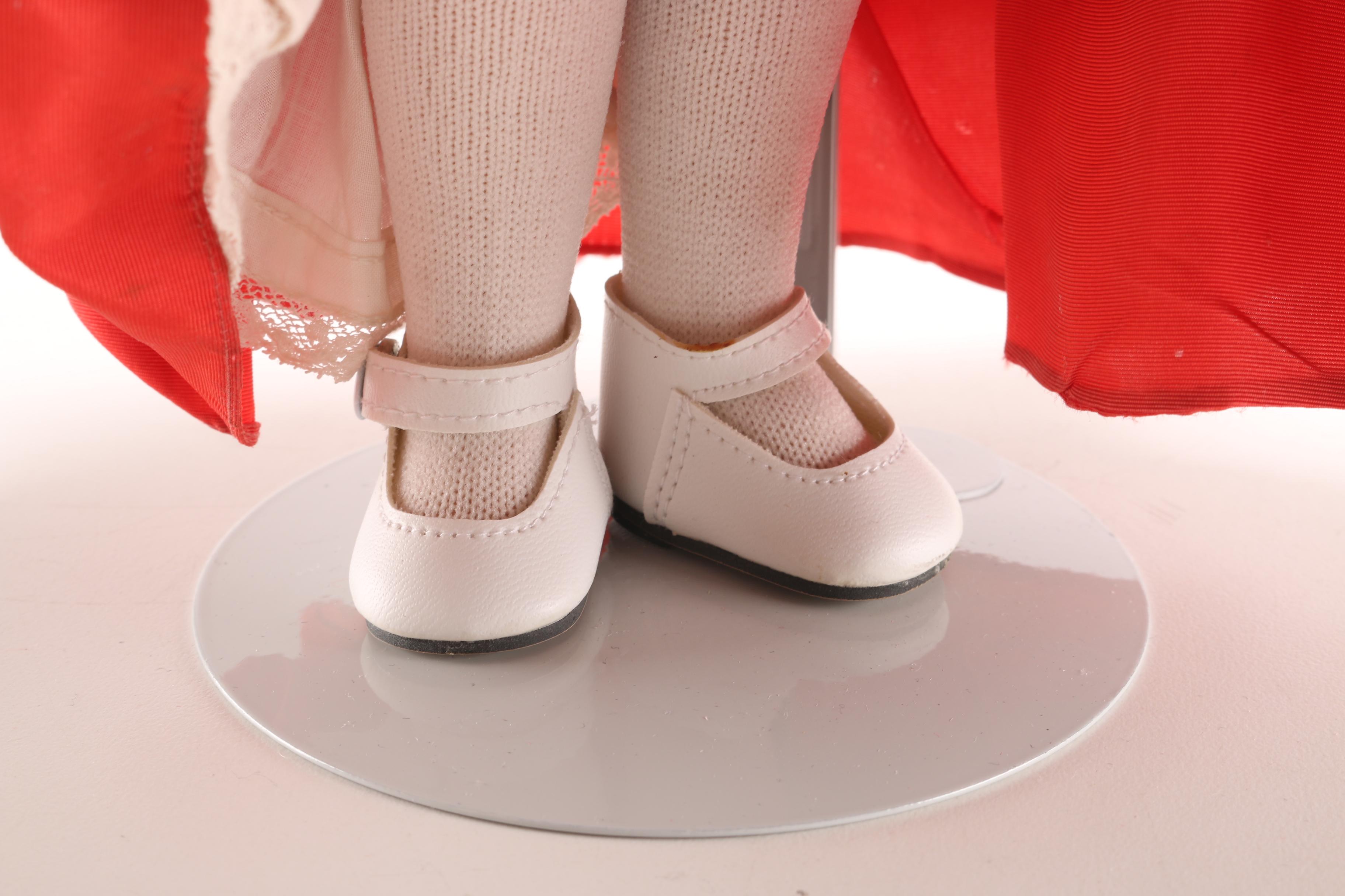 Porcelain Doll in Red Dress and Black Cloak