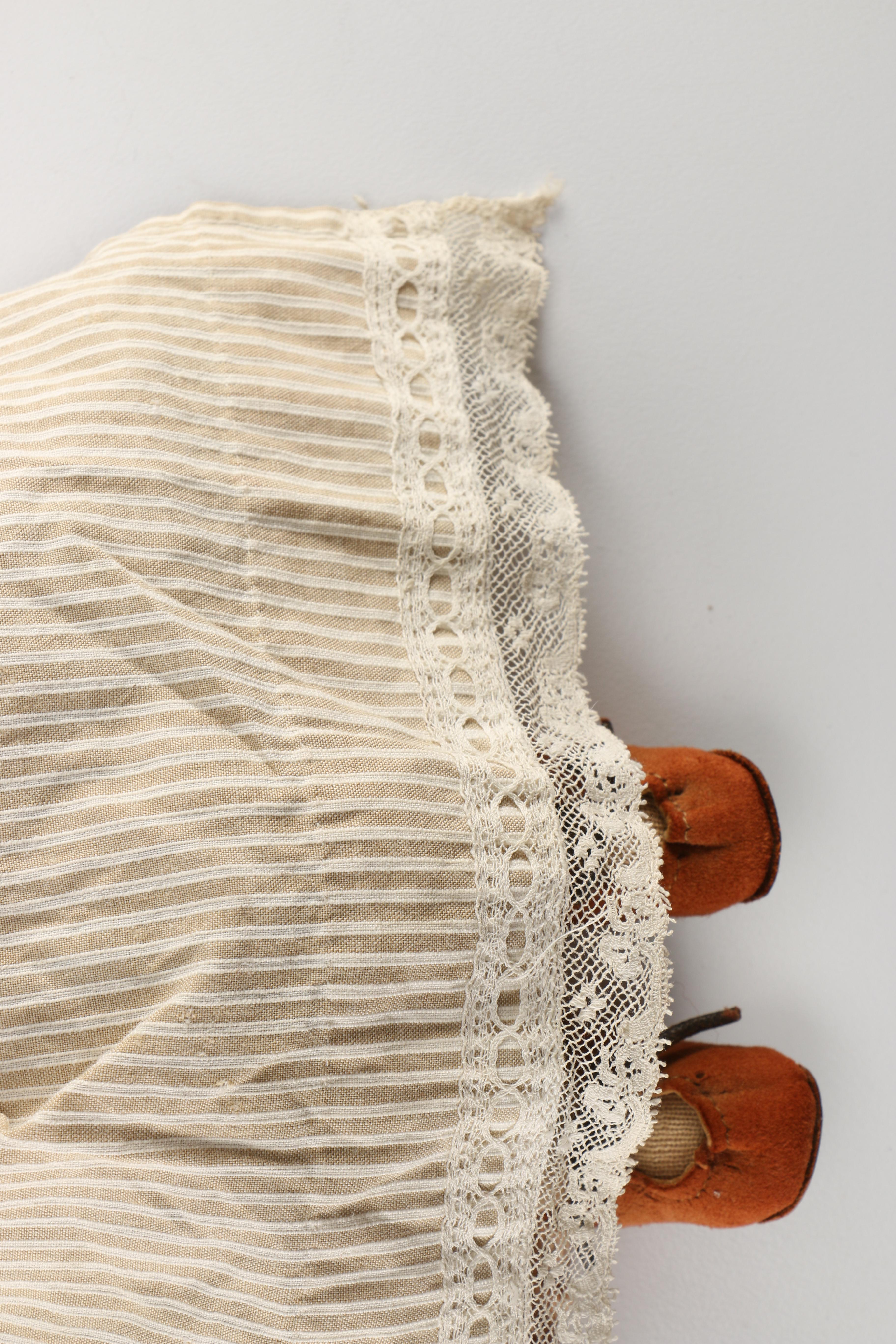 Antique Hand-Painted Bisque Doll With Inset Eyes and Leather Body