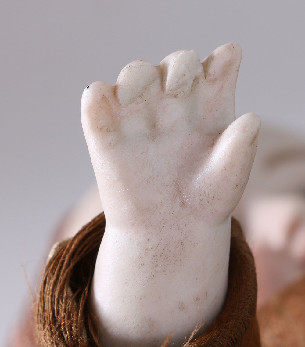 Antique Hand-Painted Bisque Doll With Inset Eyes and Leather Body