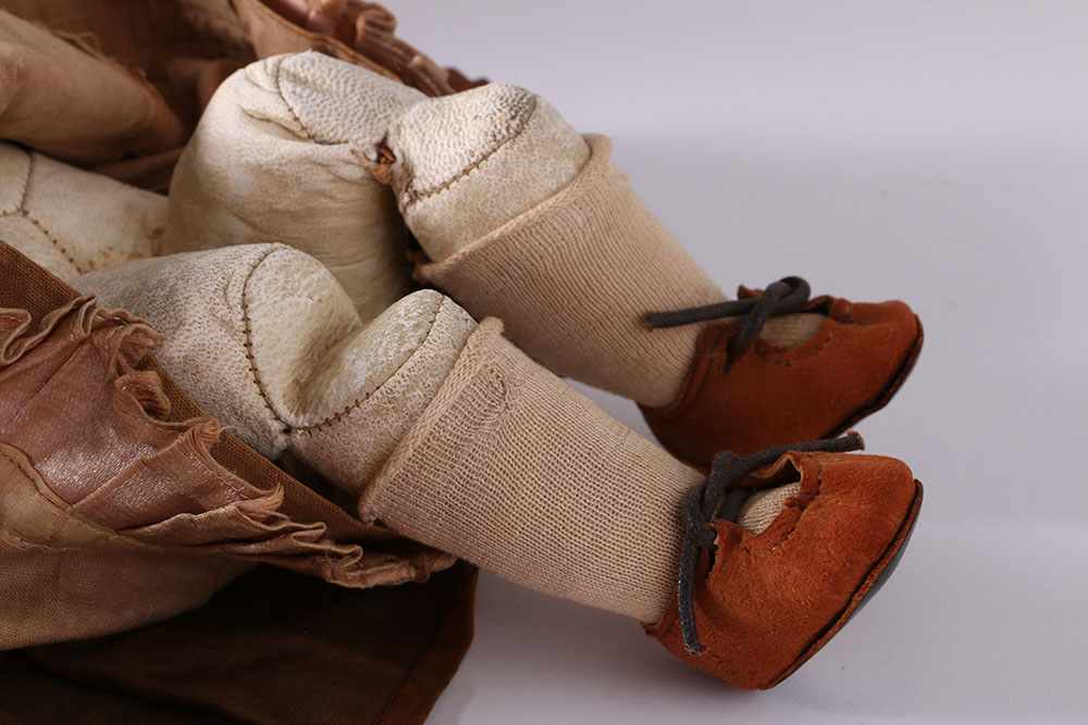 Antique Hand-Painted Bisque Doll With Inset Eyes and Leather Body