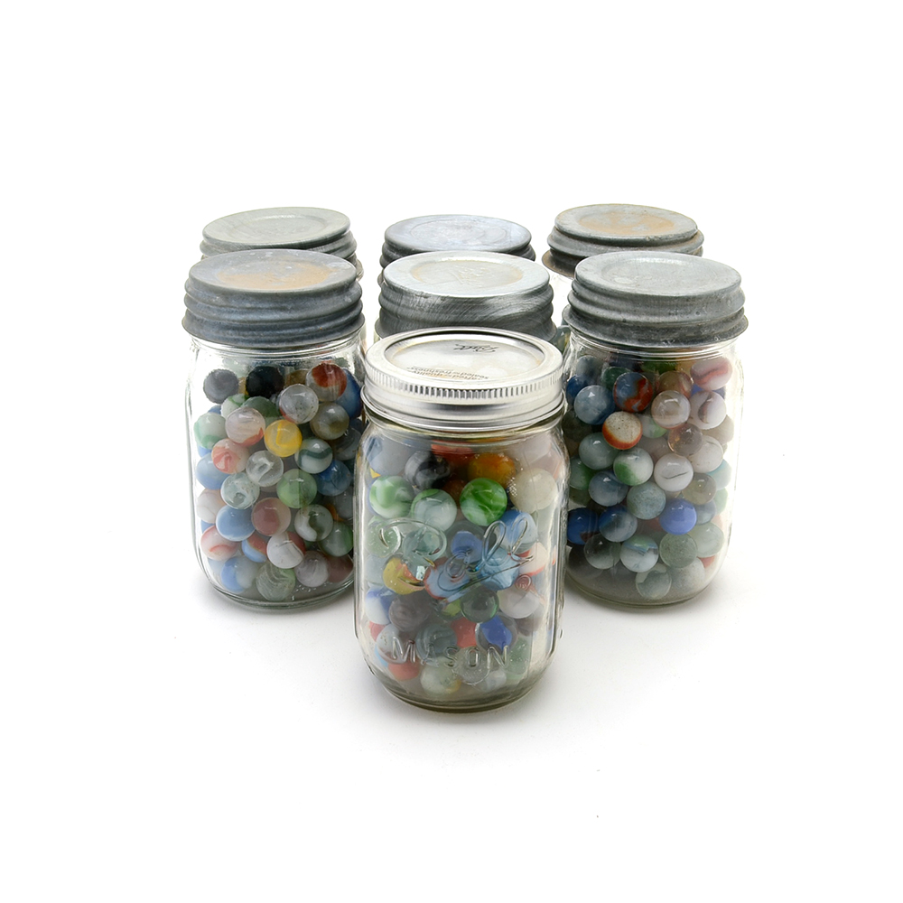Seven Vintage Jars of Marbles