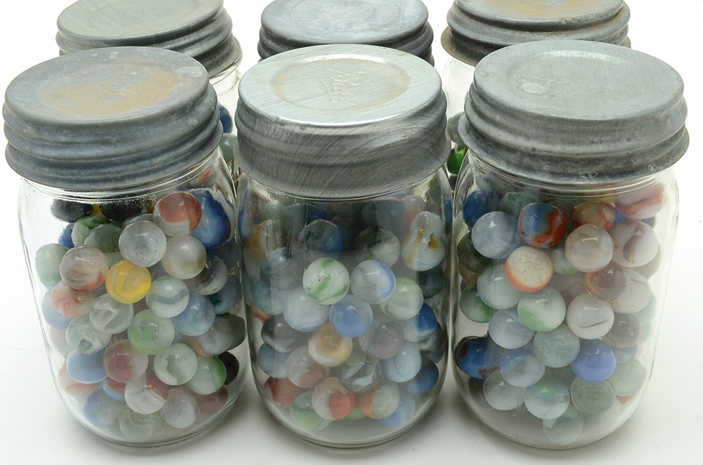 Seven Vintage Jars of Marbles