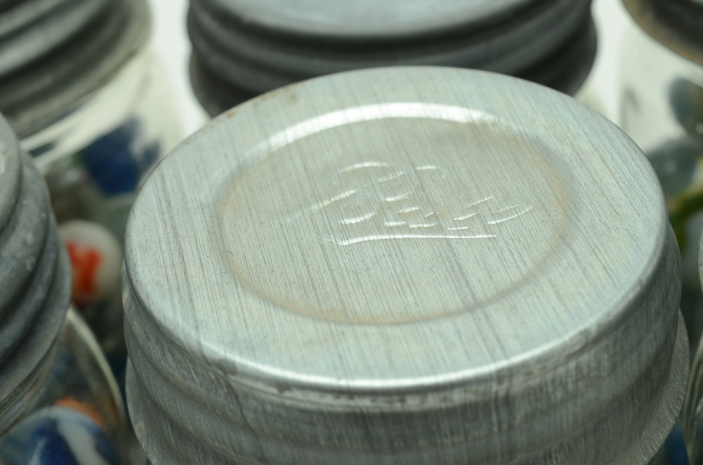 Seven Vintage Jars of Marbles