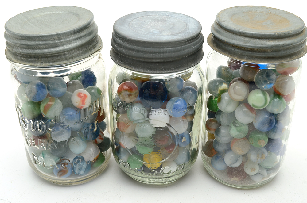Seven Vintage Jars of Marbles