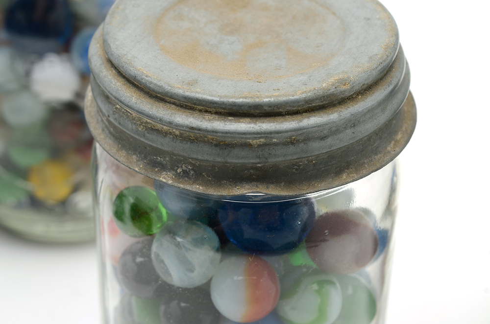 Seven Vintage Jars of Marbles