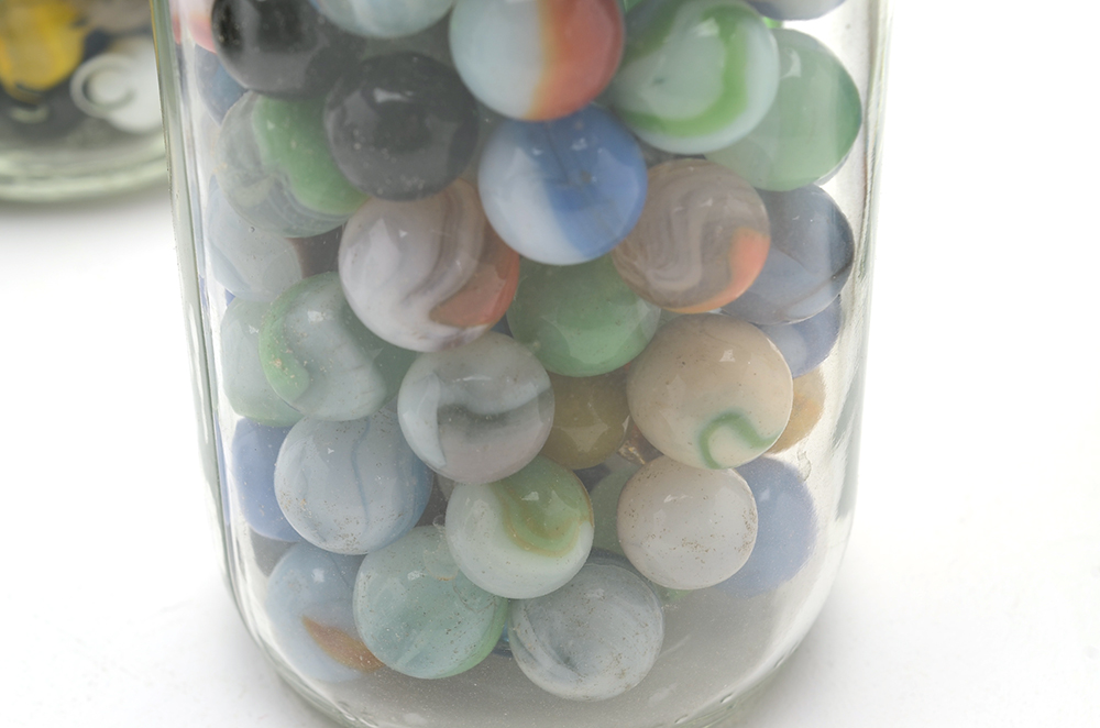 Seven Vintage Jars of Marbles