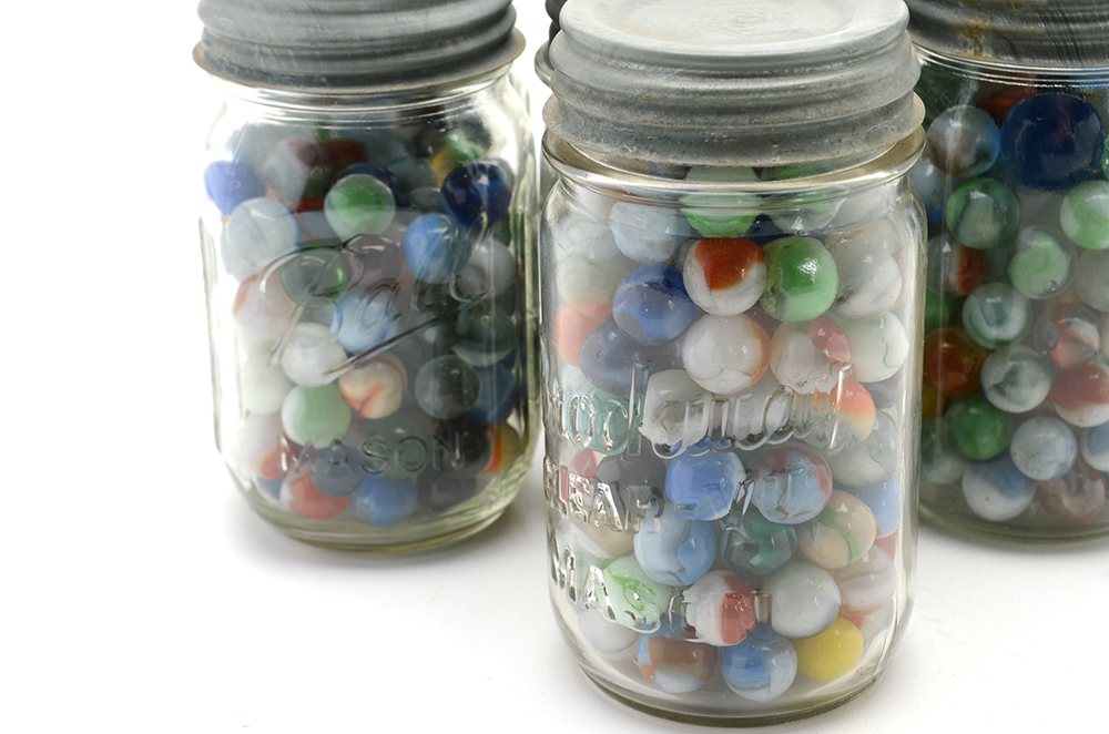Seven Vintage Jars of Marbles in Crate.