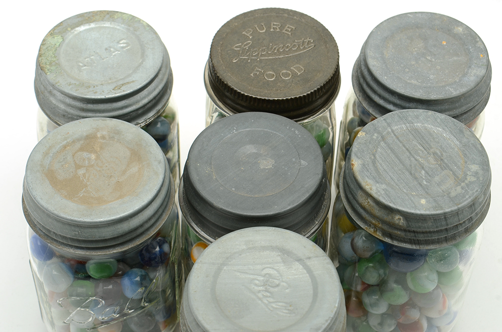 Seven Vintage Jars of Marbles in Crate.