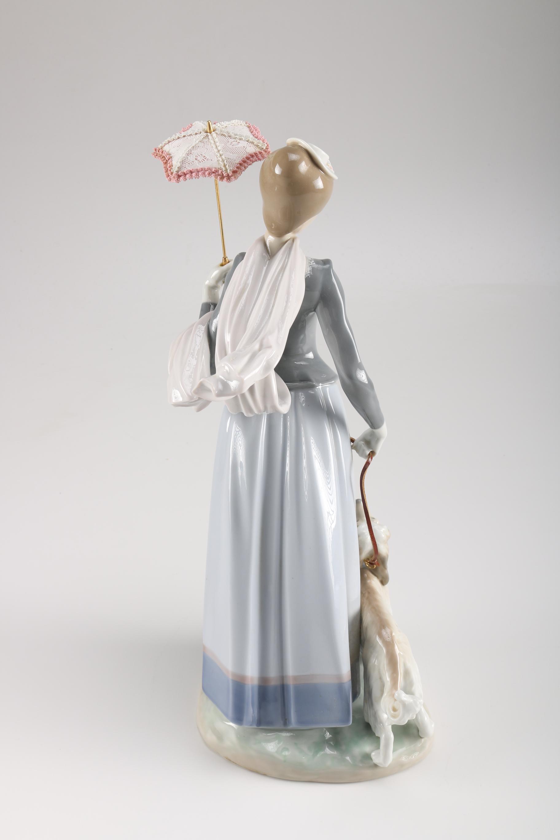 Lladró Woman and Dog Porcelain Figurine