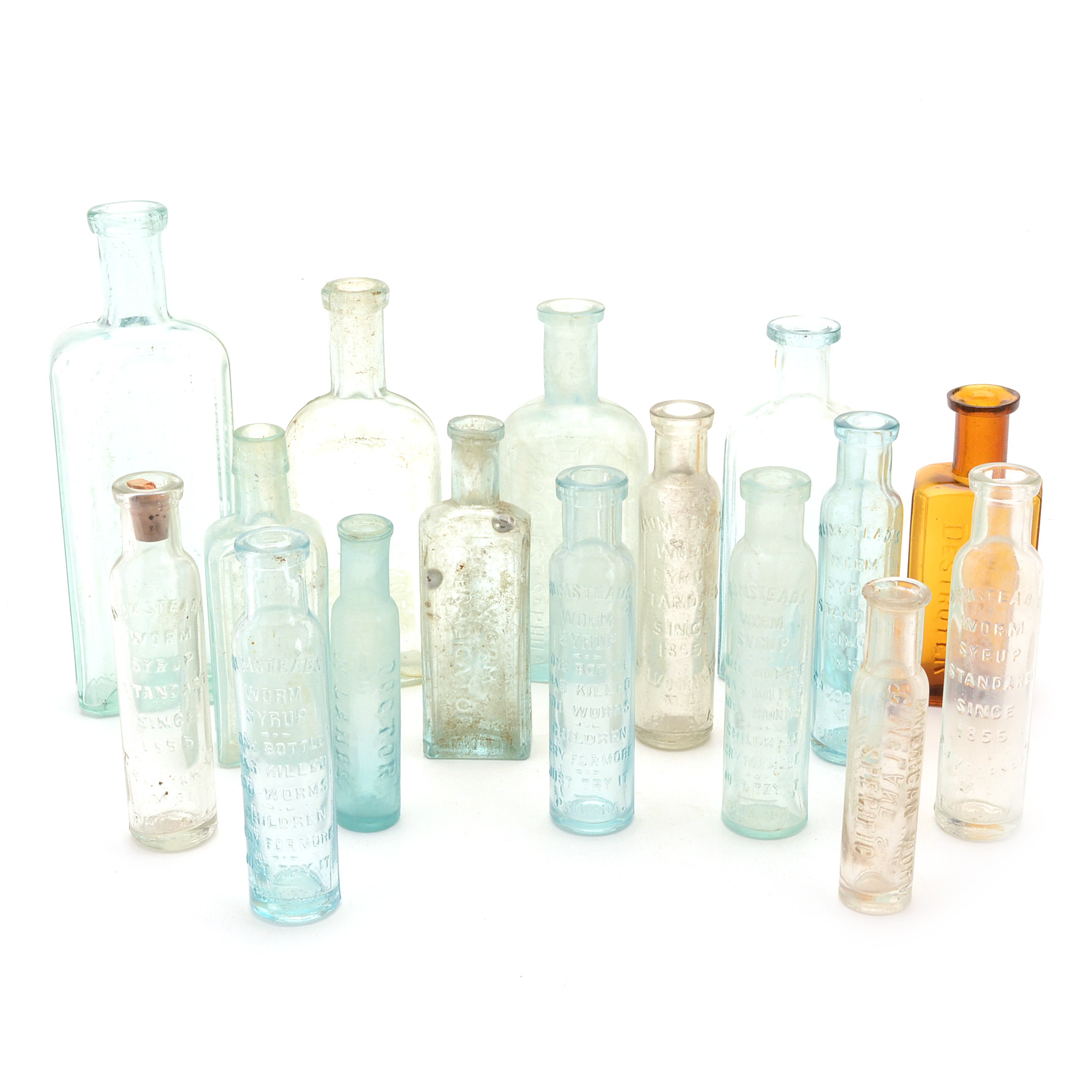 Sixteen Vintage Worm Remedy Bottles