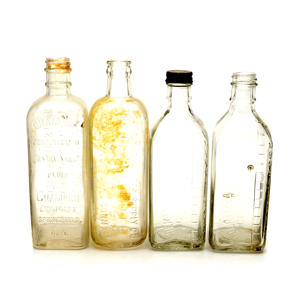Four Vintage Embalming Fluid Bottles
