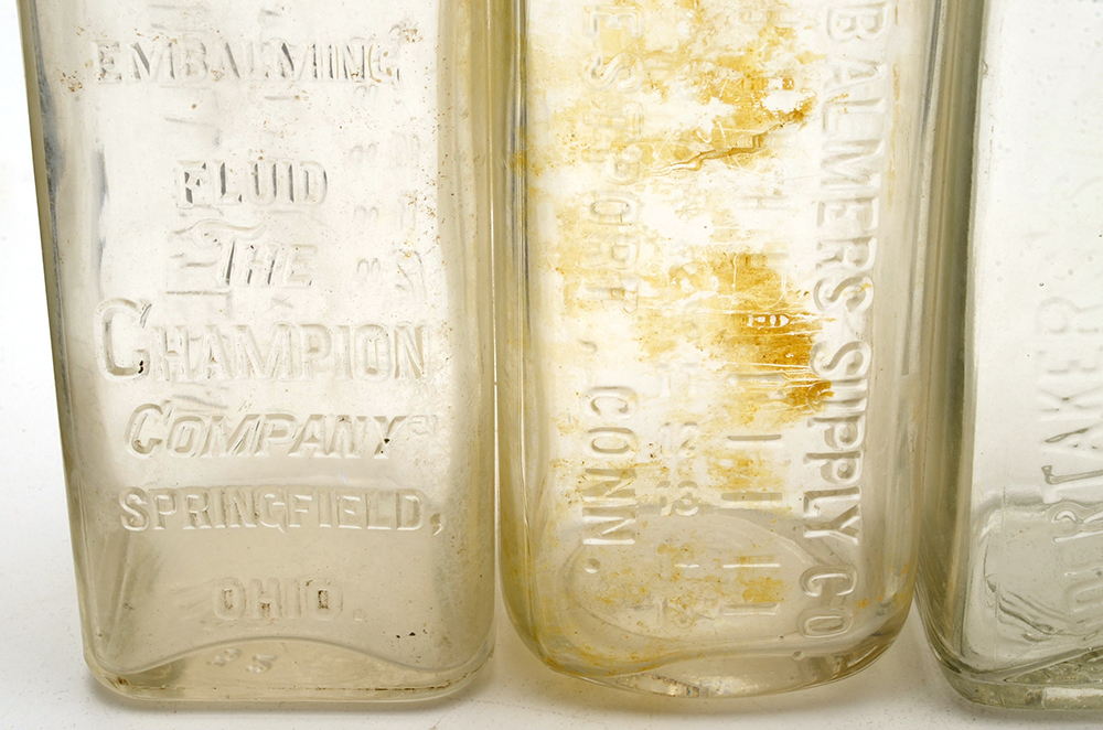 Four Vintage Embalming Fluid Bottles