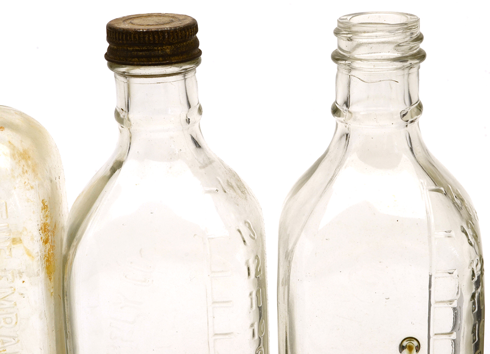 Four Vintage Embalming Fluid Bottles