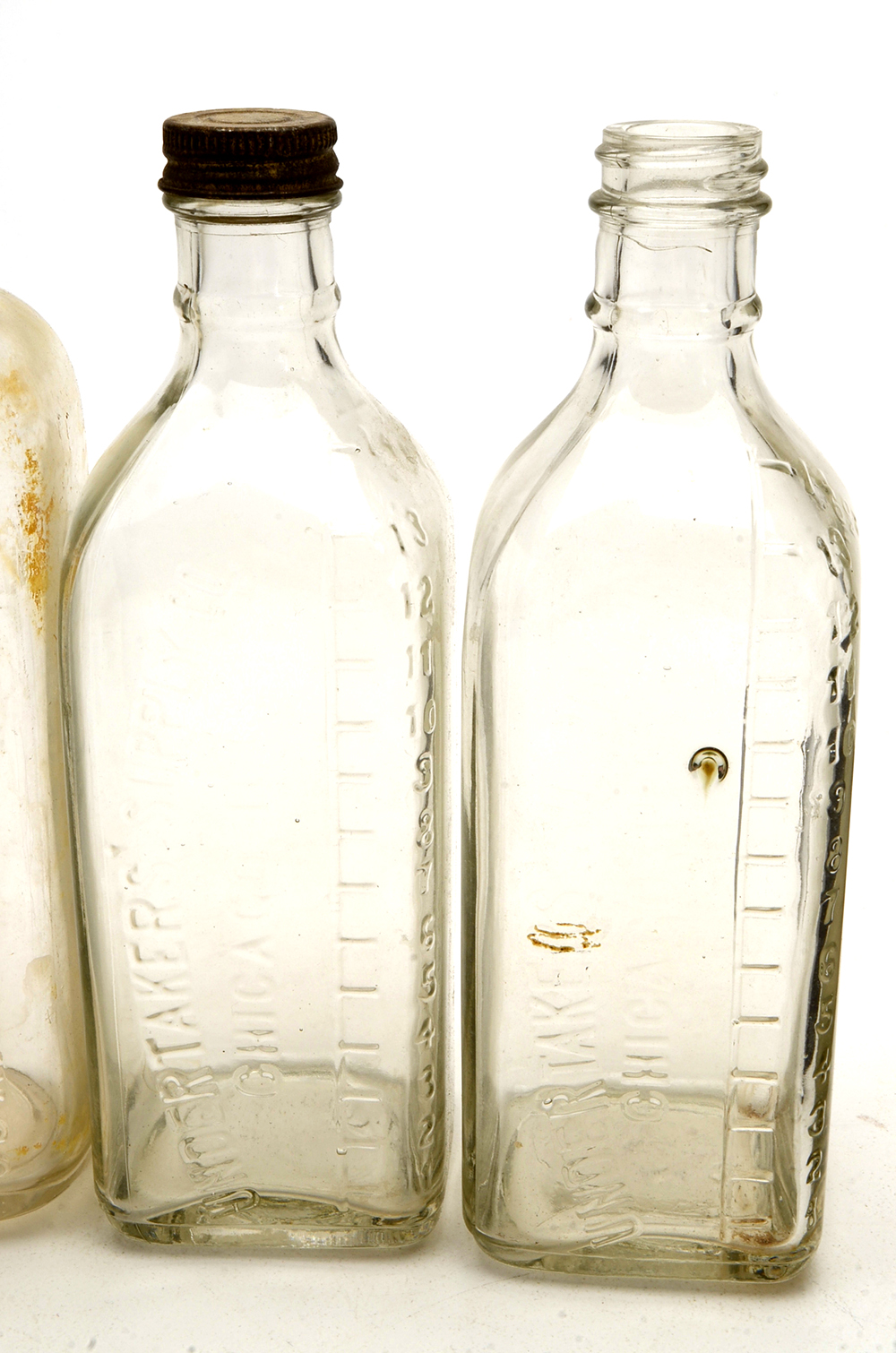 Four Vintage Embalming Fluid Bottles
