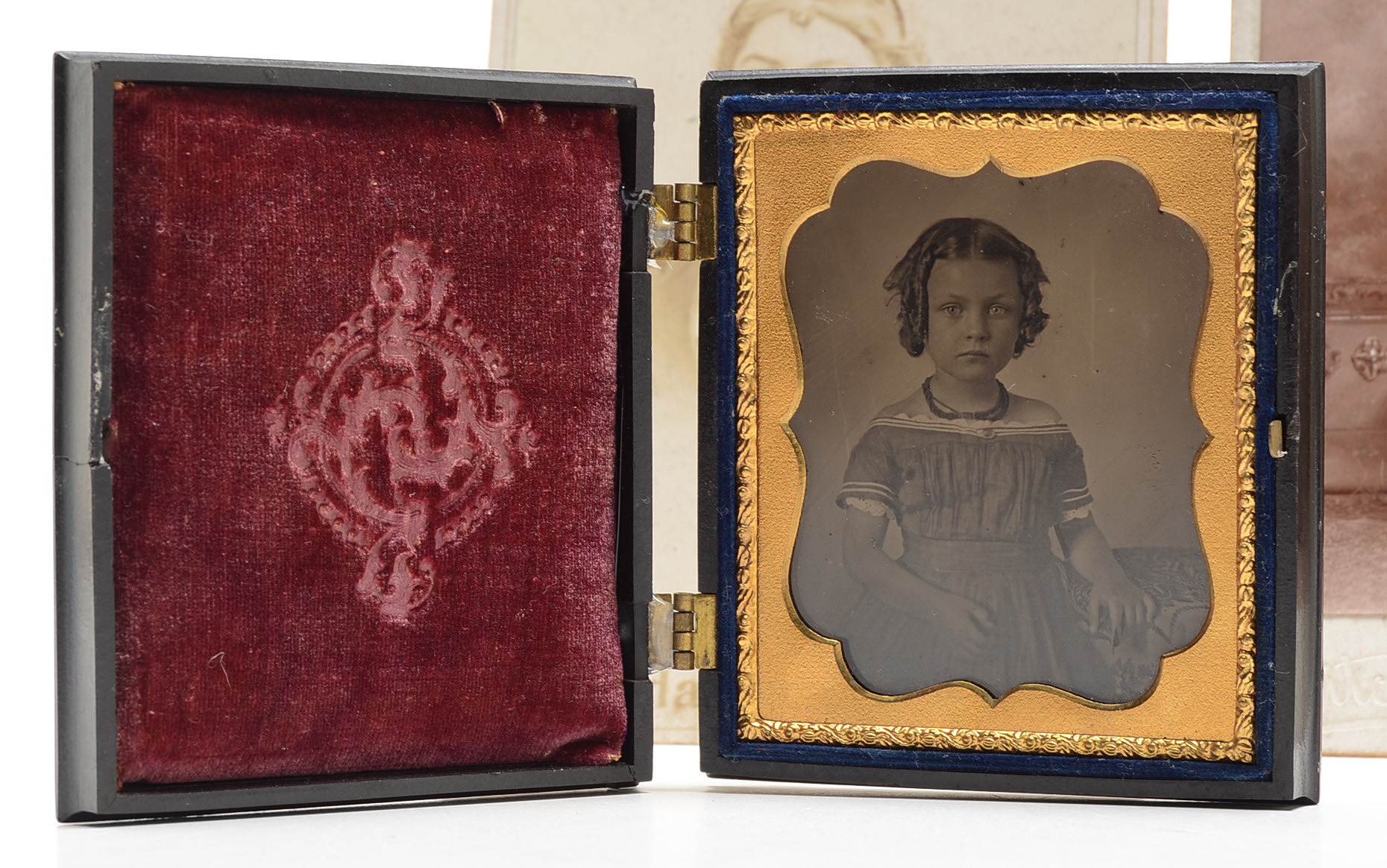 Early Portrait Photographs and Cast Iron Parasol Hook