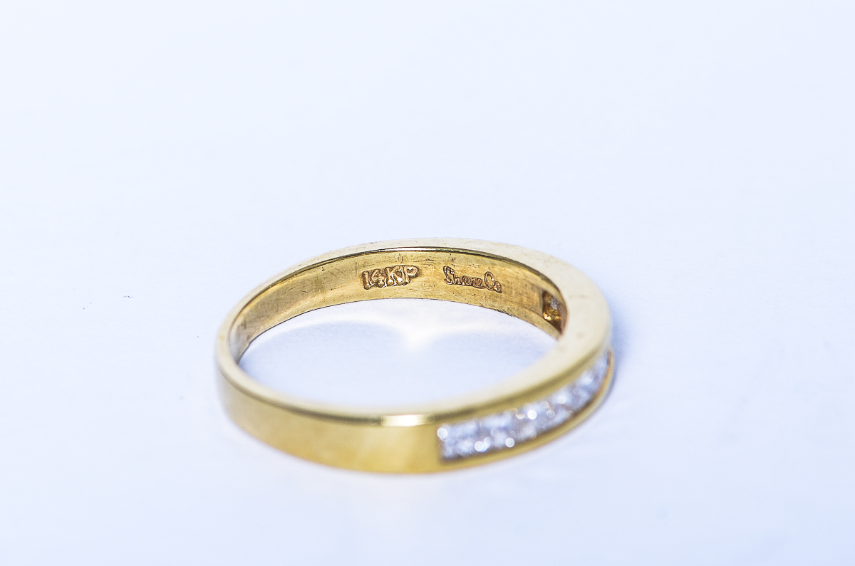 14K Yellow Gold and Invisible Set Diamond Band by Shane Company