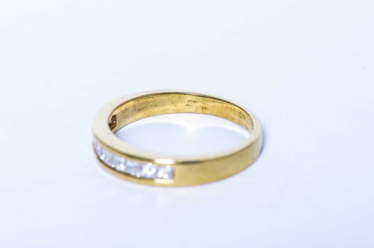 14K Yellow Gold and Invisible Set Diamond Band by Shane Company