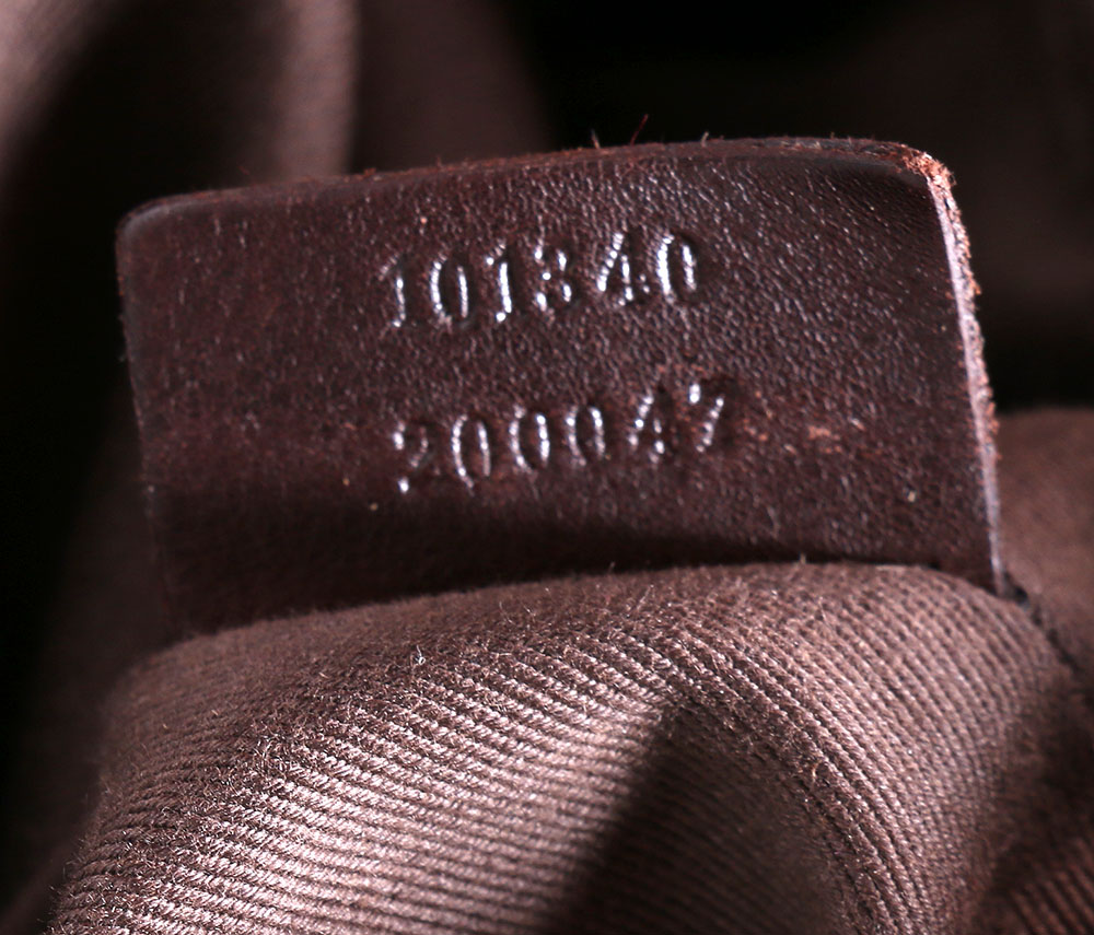 Gucci Monogrammed Canvas Drawstring Hobo Bag