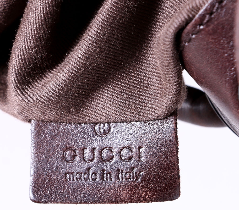 Gucci Monogrammed Canvas Drawstring Hobo Bag