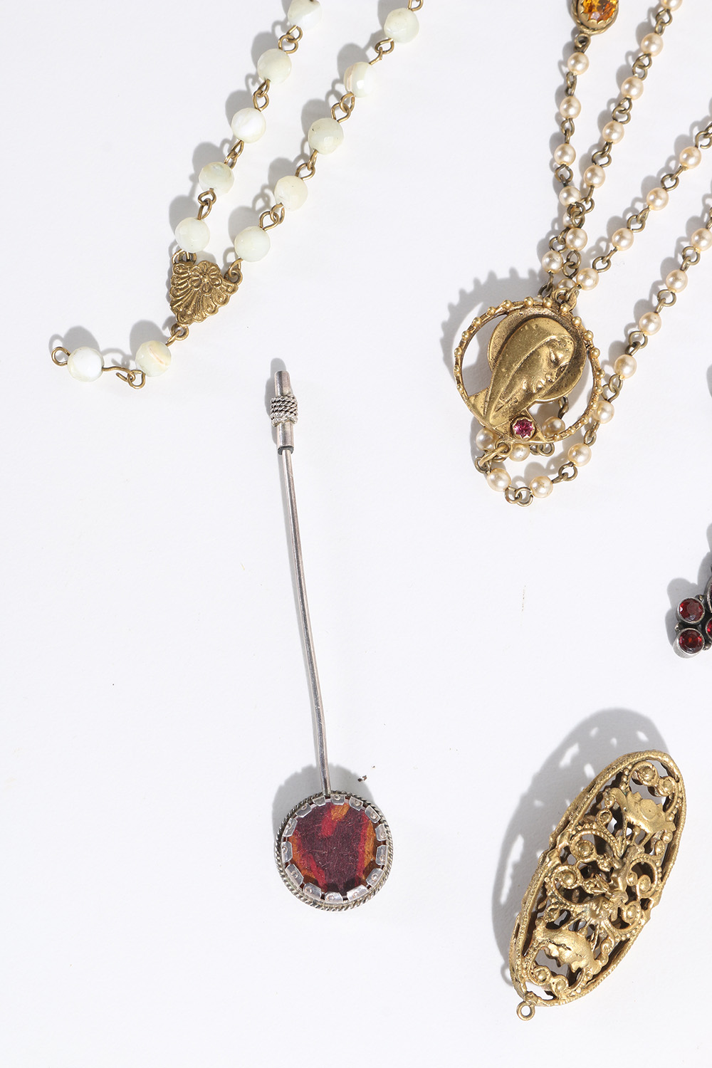 Costume Jewelry Assortment Featuring Virgins, Saints and Angels