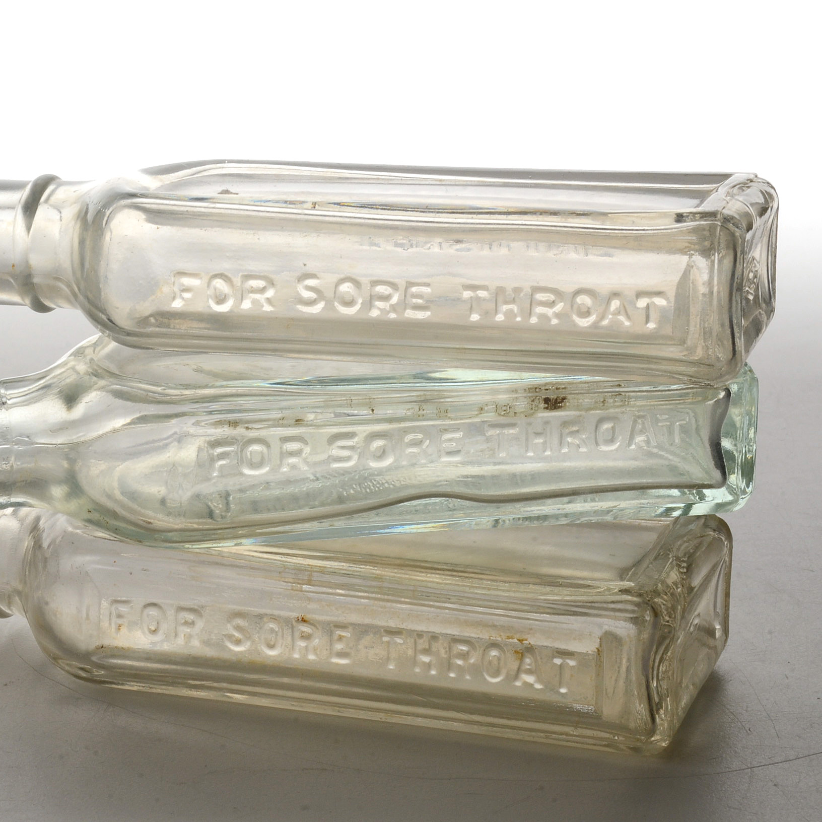 Collection of Antique Tonsiline Glass Medicine Bottles