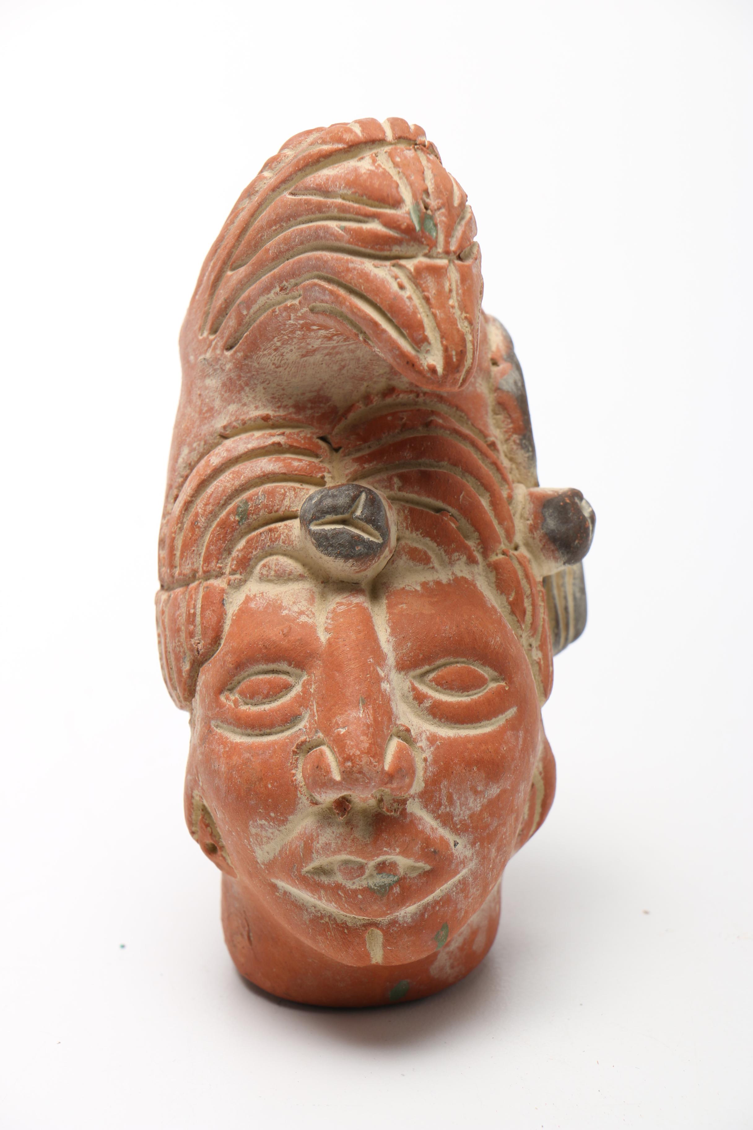 Pair Of Carved Faces