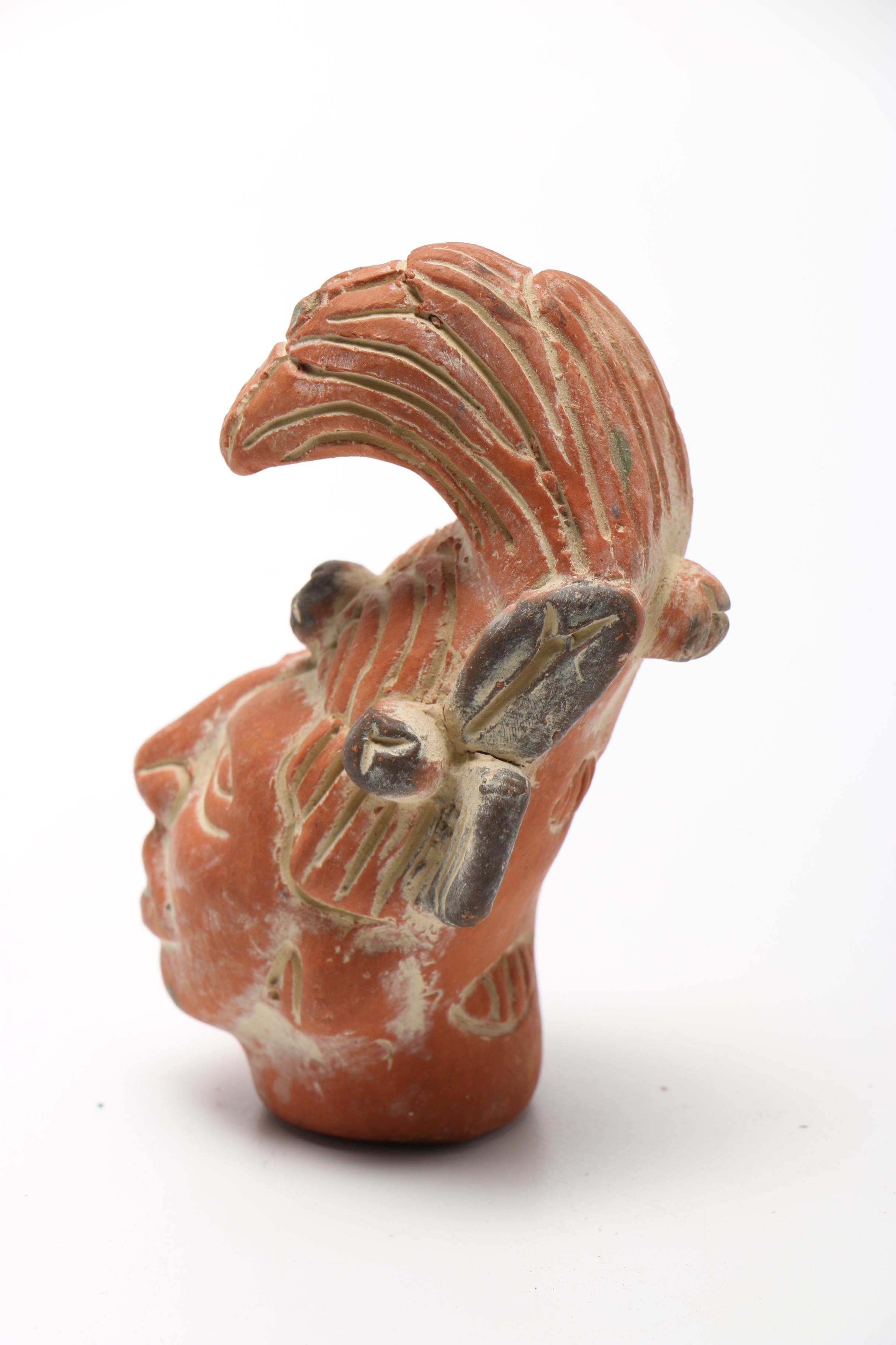 Pair Of Carved Faces