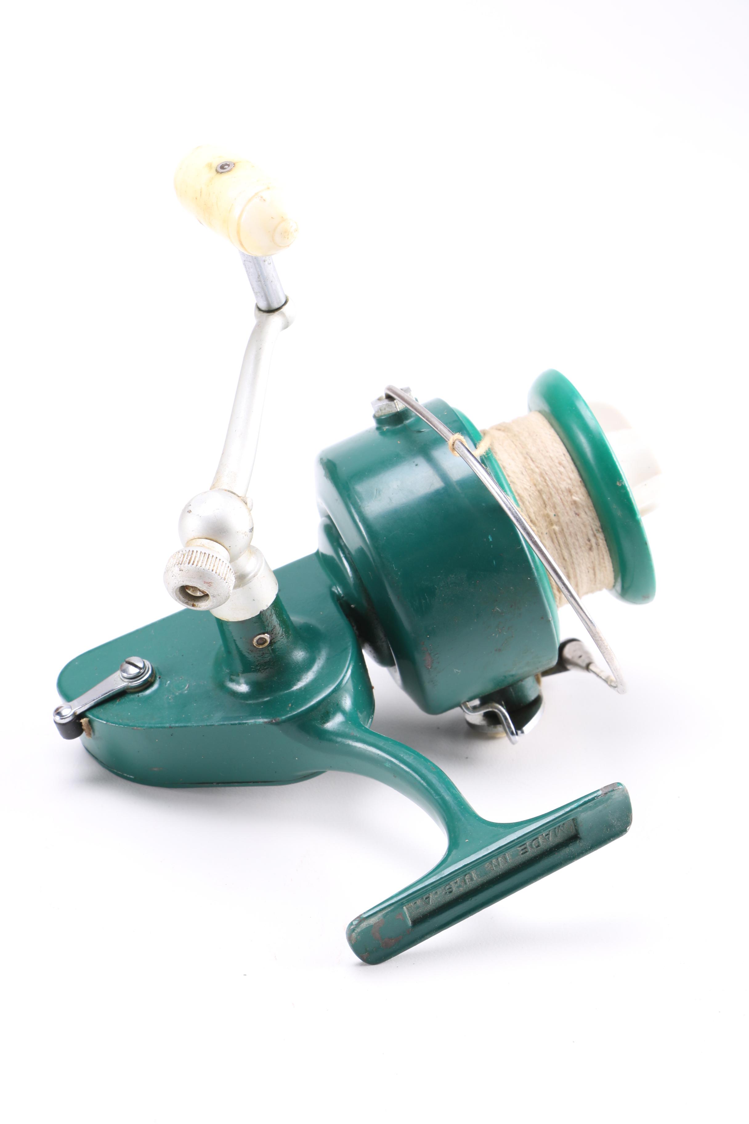 Collection of Vintage Fishing Lures and Reels With Tackle Box