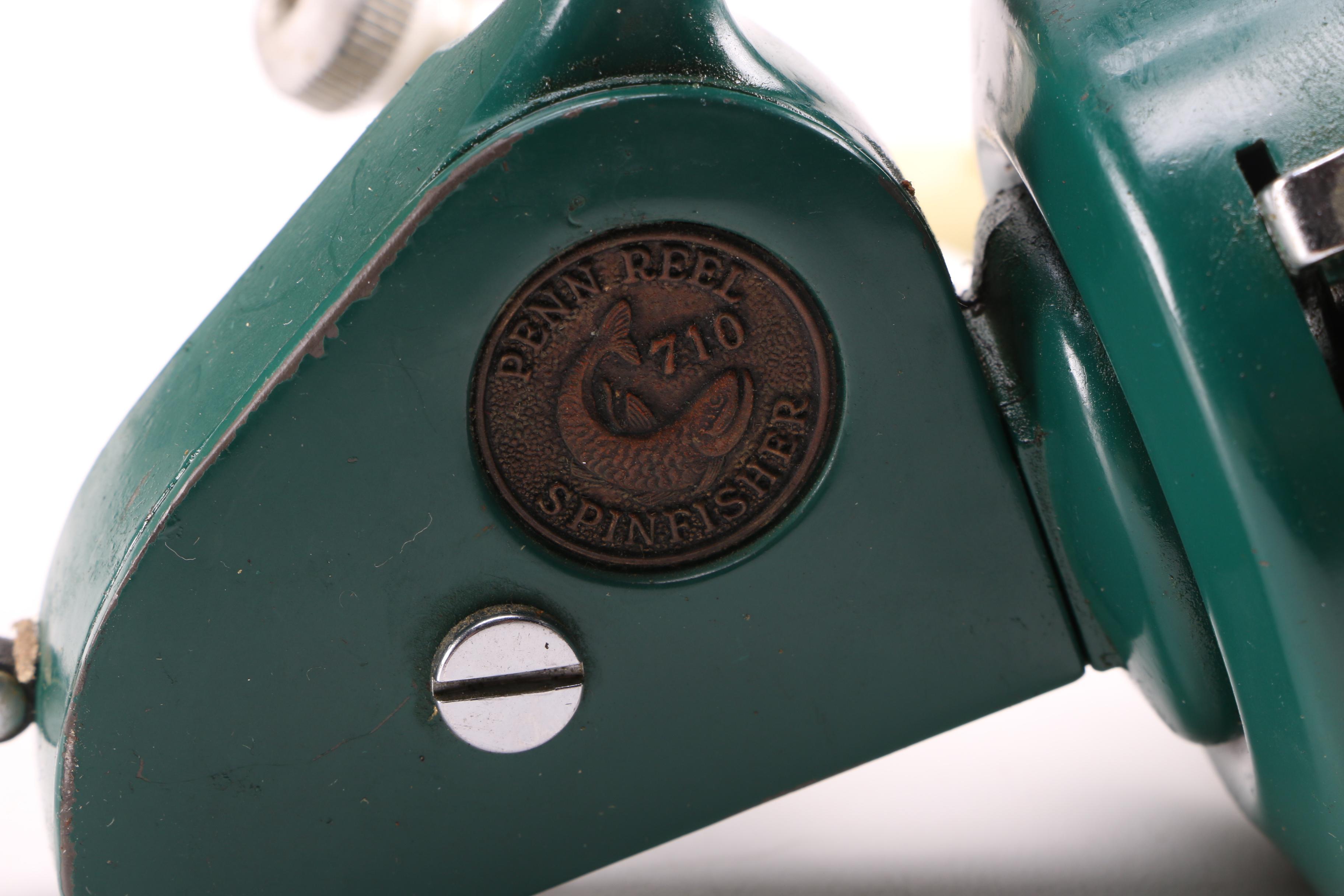 Collection of Vintage Fishing Lures and Reels With Tackle Box