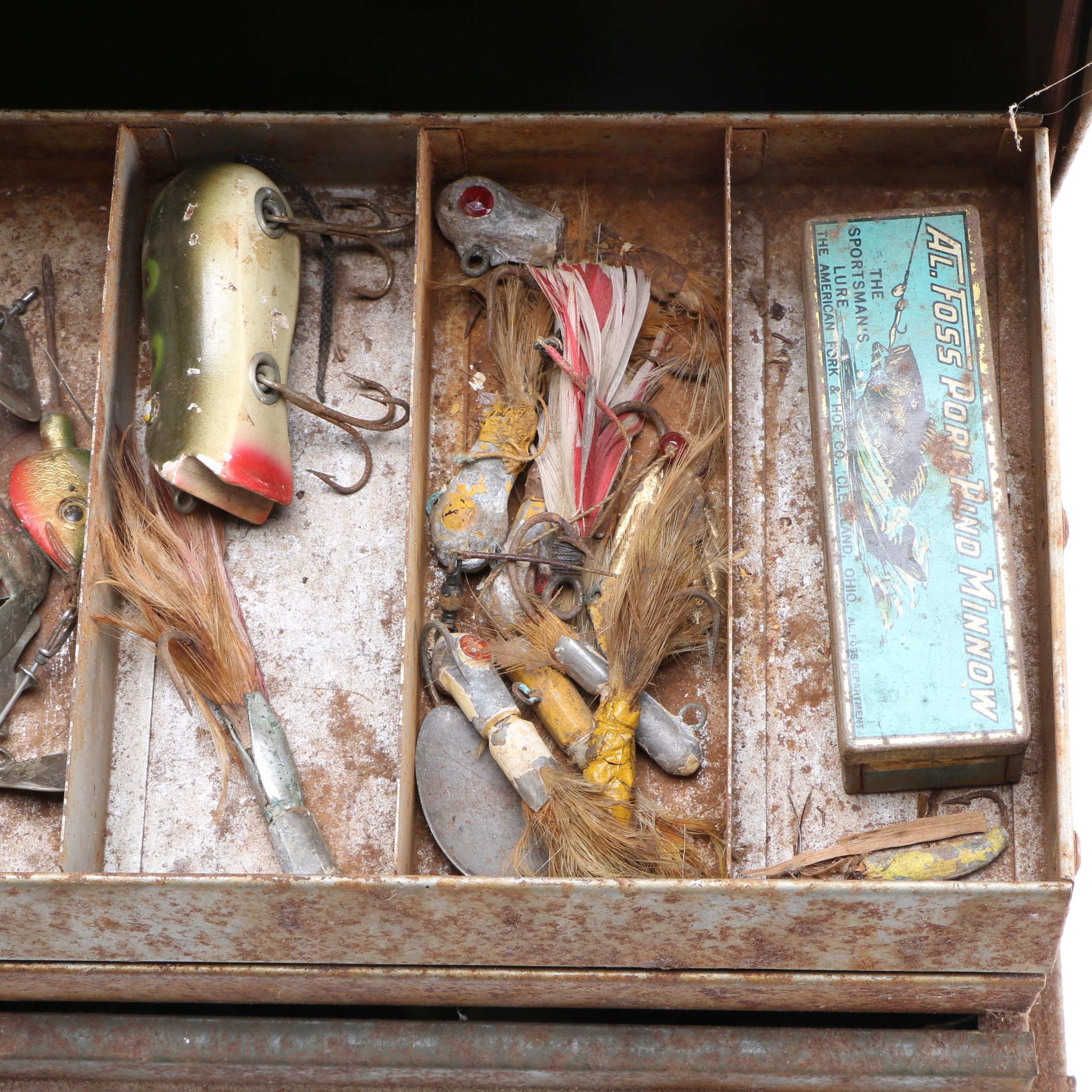 Collection of Vintage Fishing Lures and Reels With Tackle Box