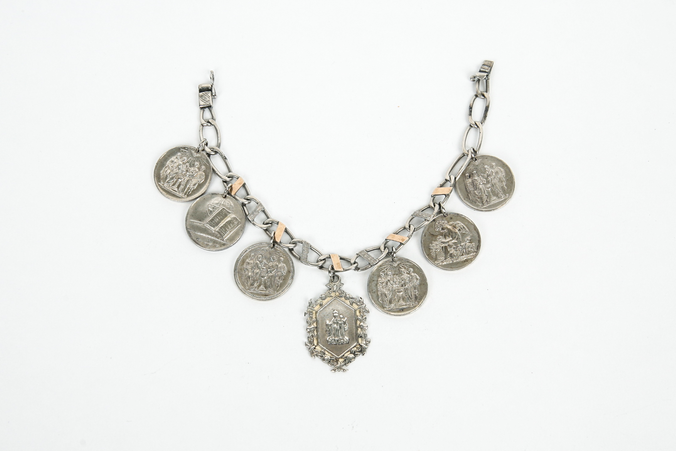 Sterling Silver Bracelet with Seven Antique Sterling Silver Baptismal Medals