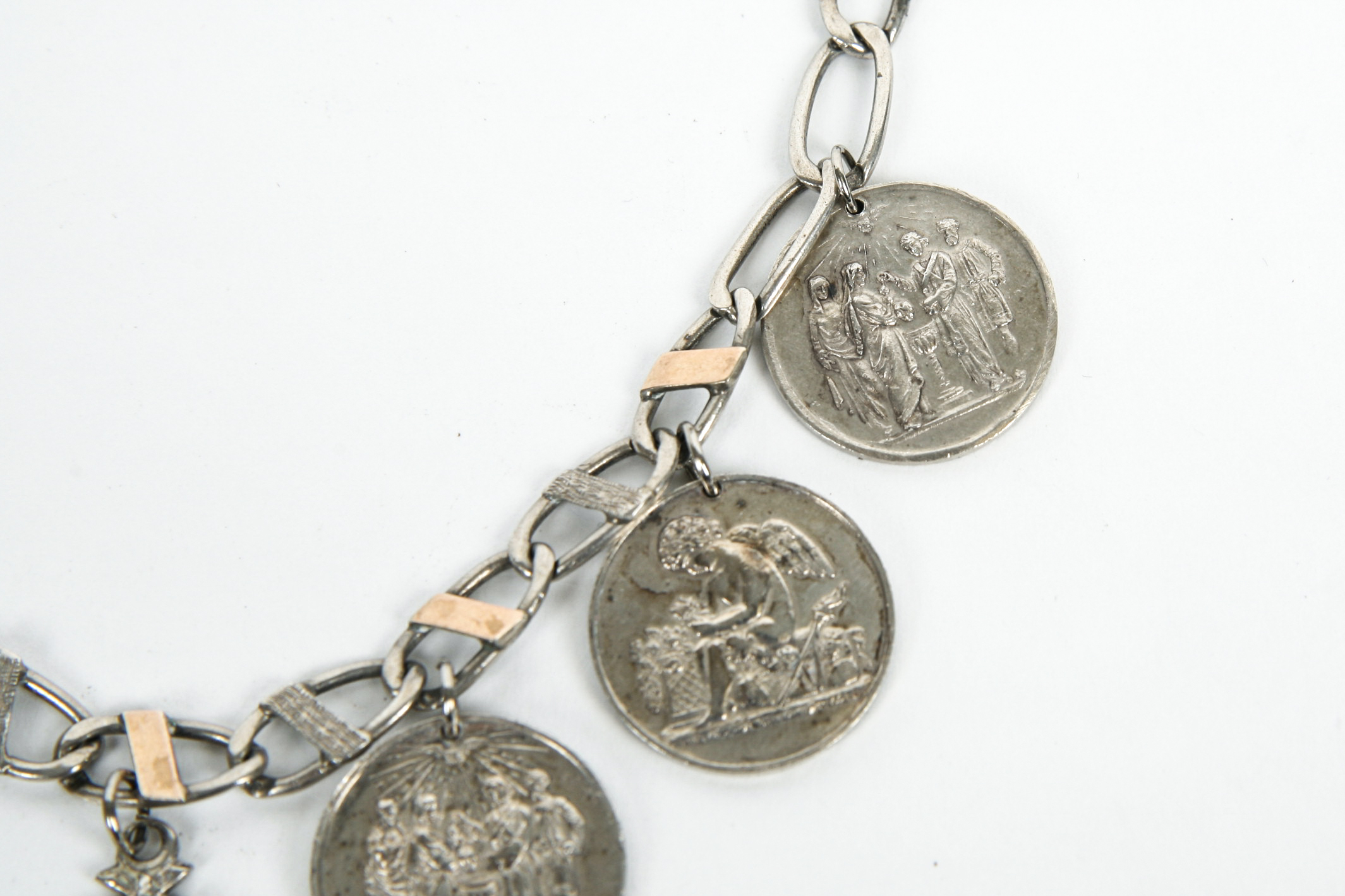 Sterling Silver Bracelet with Seven Antique Sterling Silver Baptismal Medals