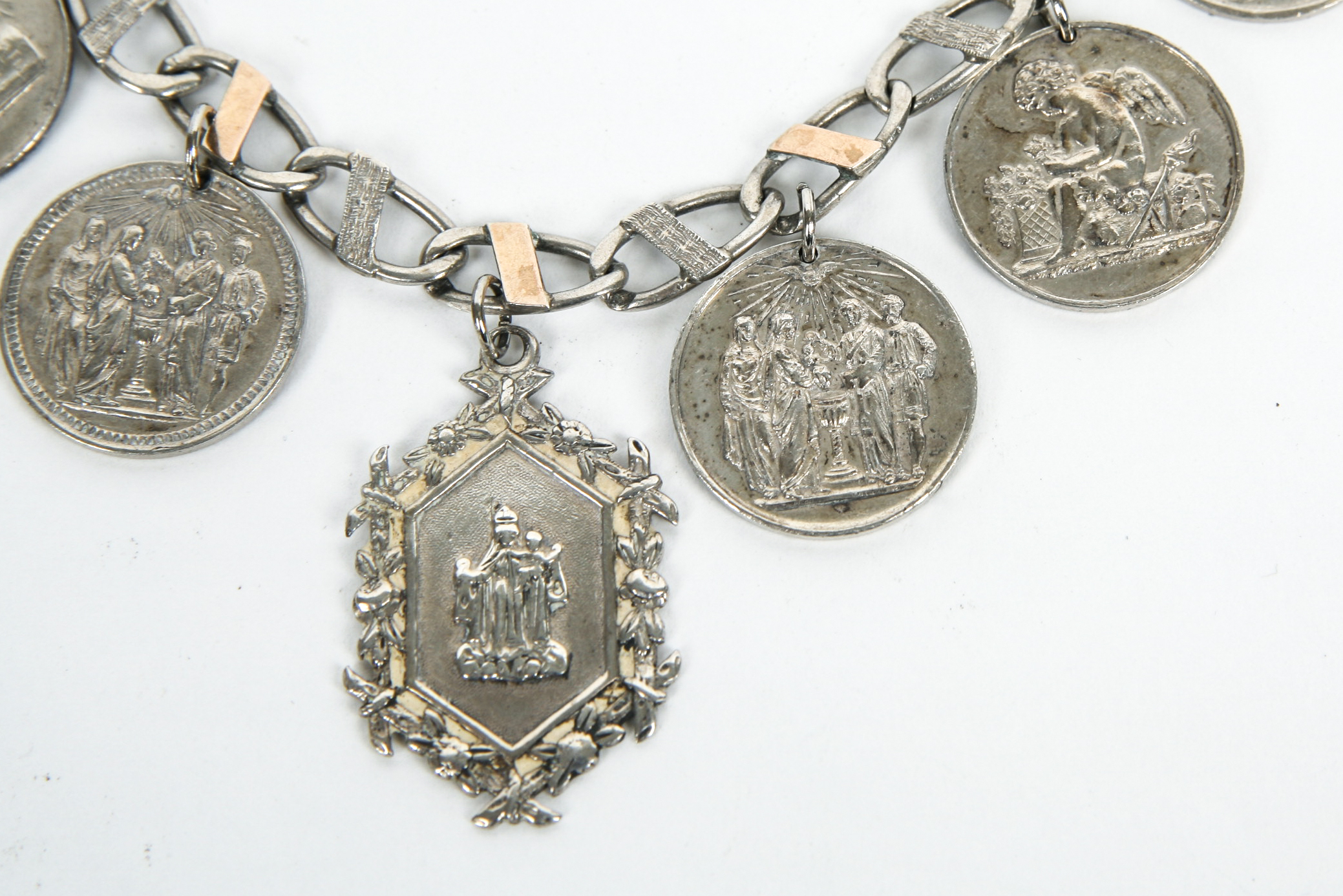 Sterling Silver Bracelet with Seven Antique Sterling Silver Baptismal Medals