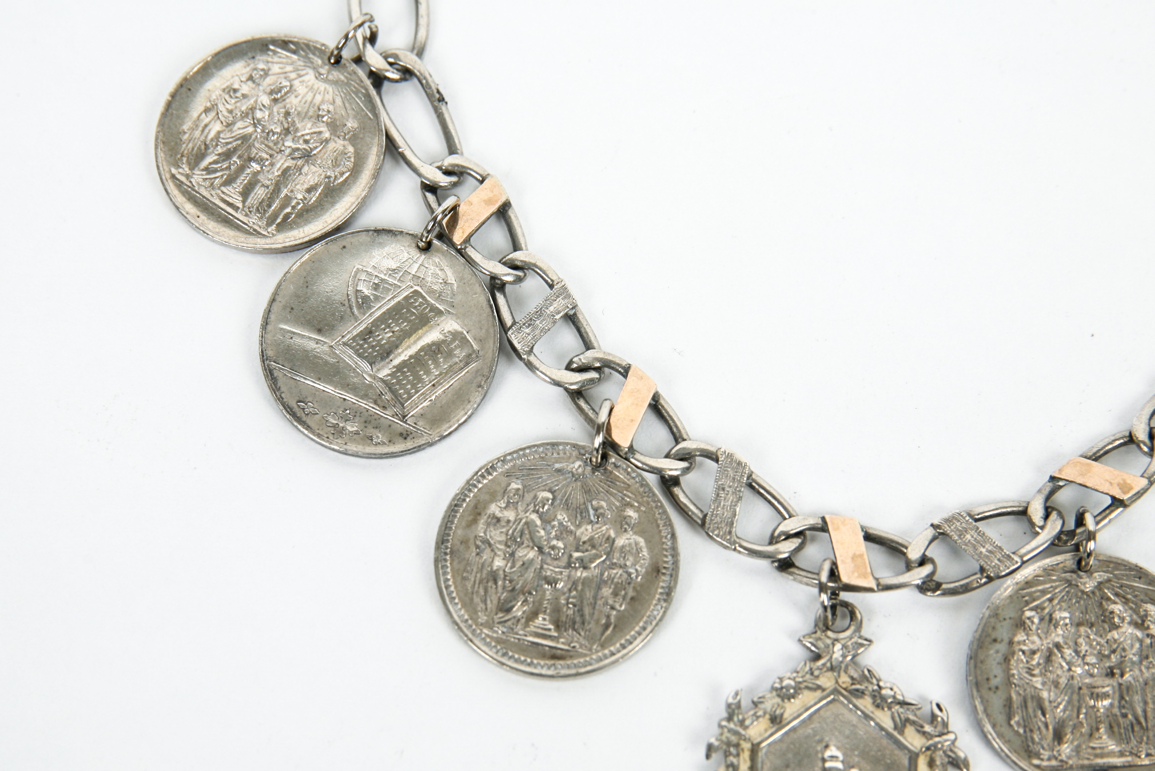 Sterling Silver Bracelet with Seven Antique Sterling Silver Baptismal Medals
