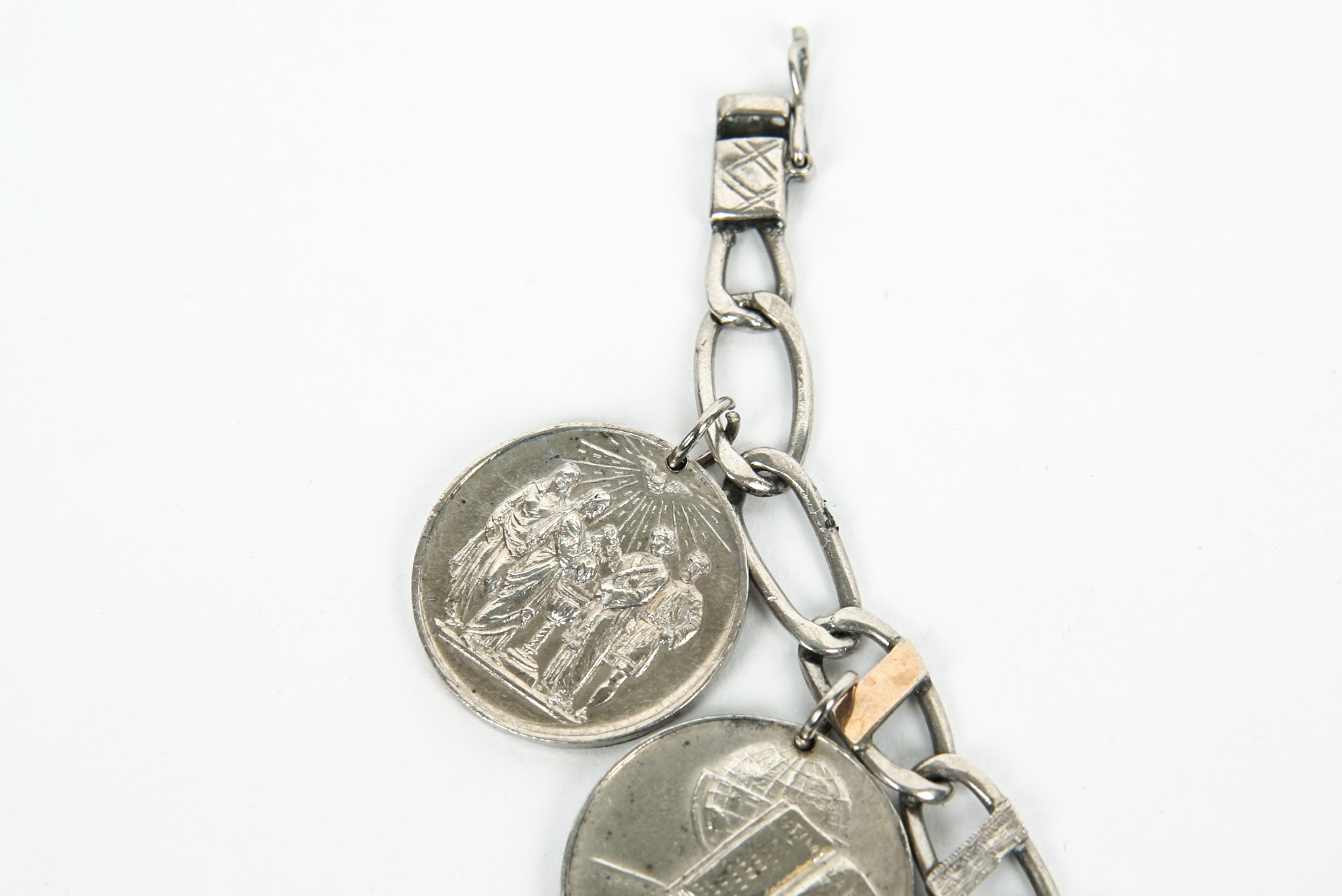 Sterling Silver Bracelet with Seven Antique Sterling Silver Baptismal Medals