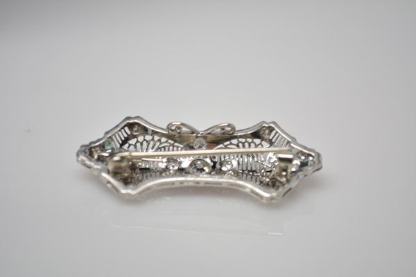 Antique Edwardian Platinum Diamond Brooch With Onyx and Emerald Accents