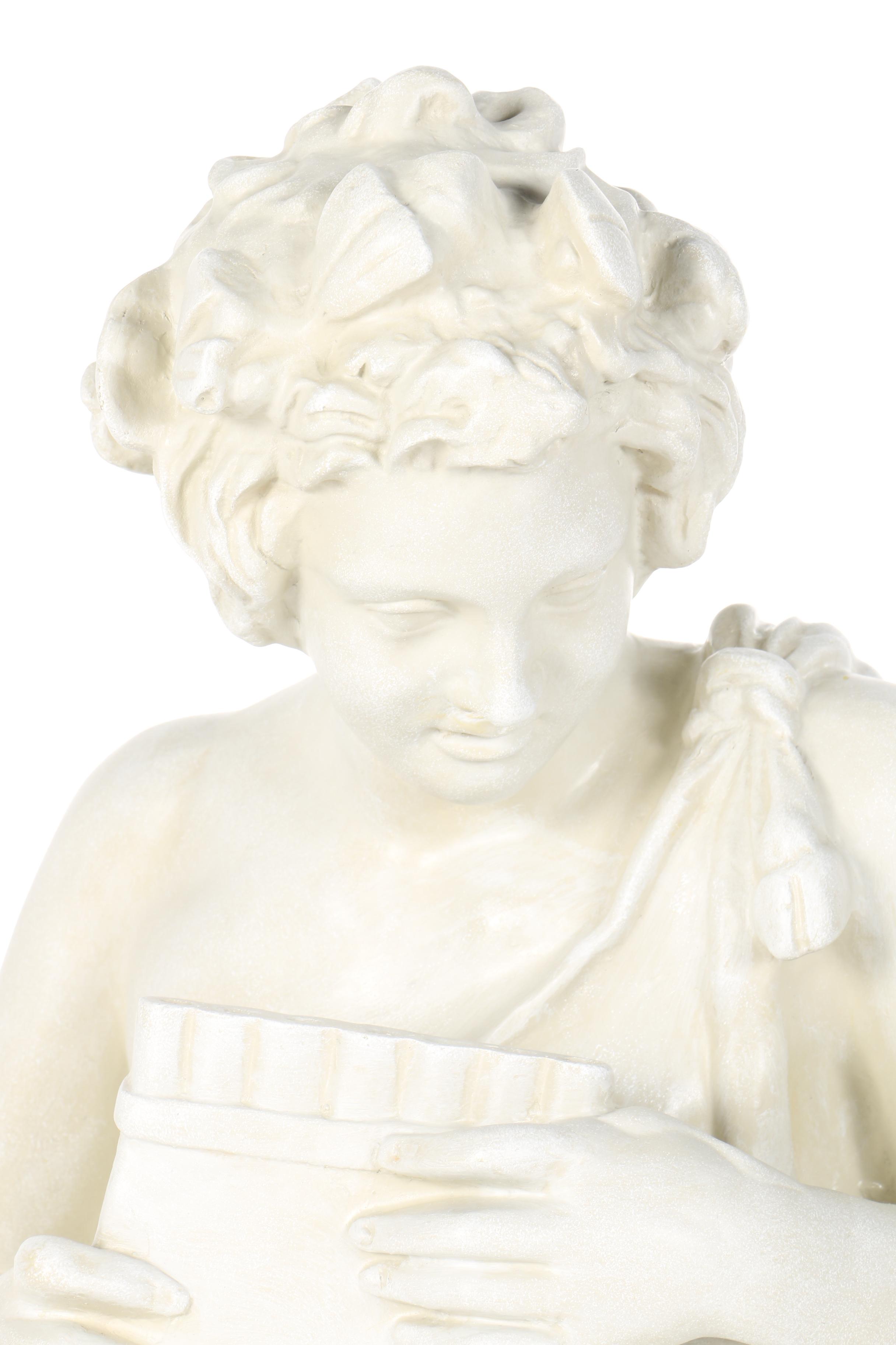 Sculpture of a Boy Holding a Panpipe