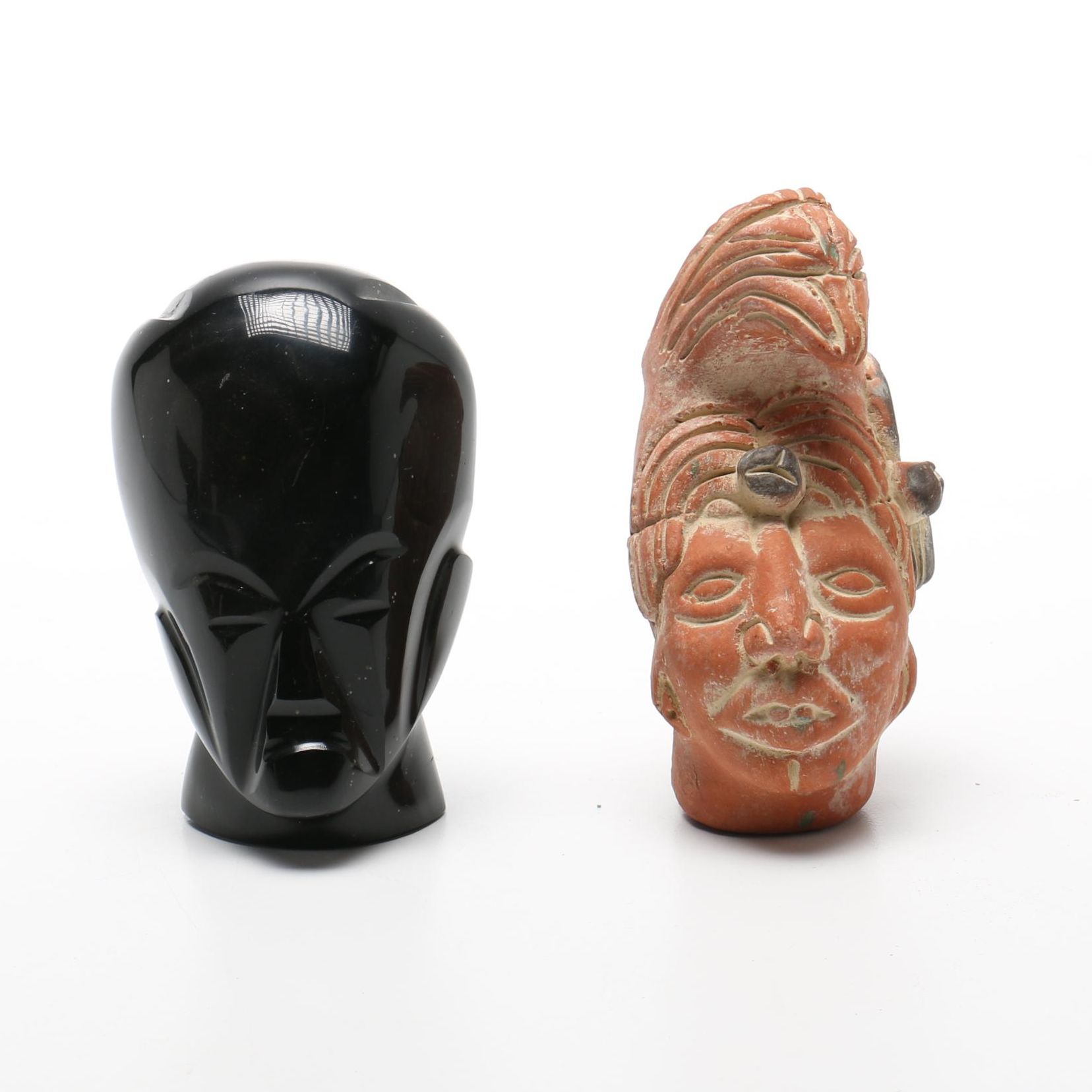Pair Of Carved Faces
