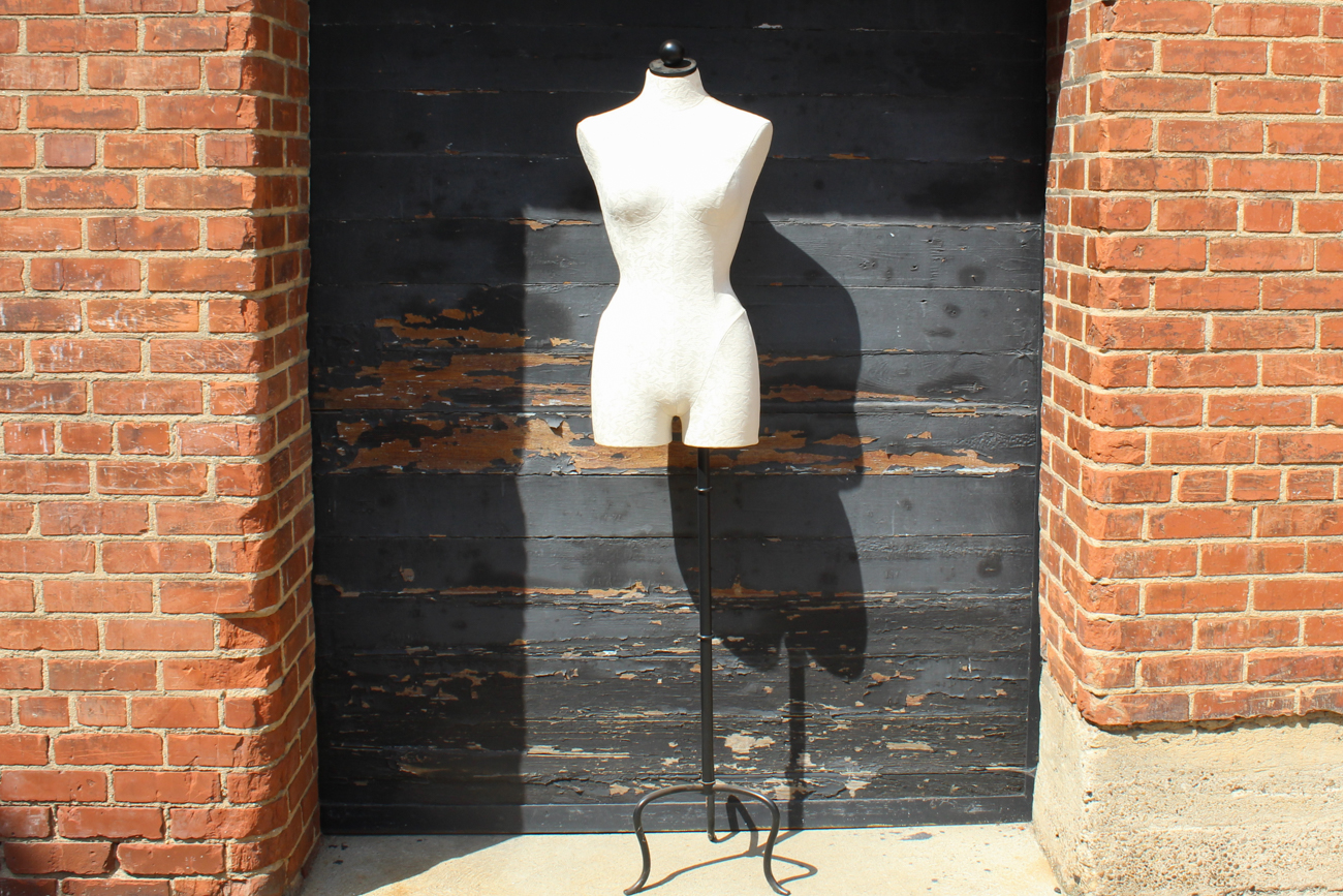 White Upholstered Dress Form On Wrought Iron Stand