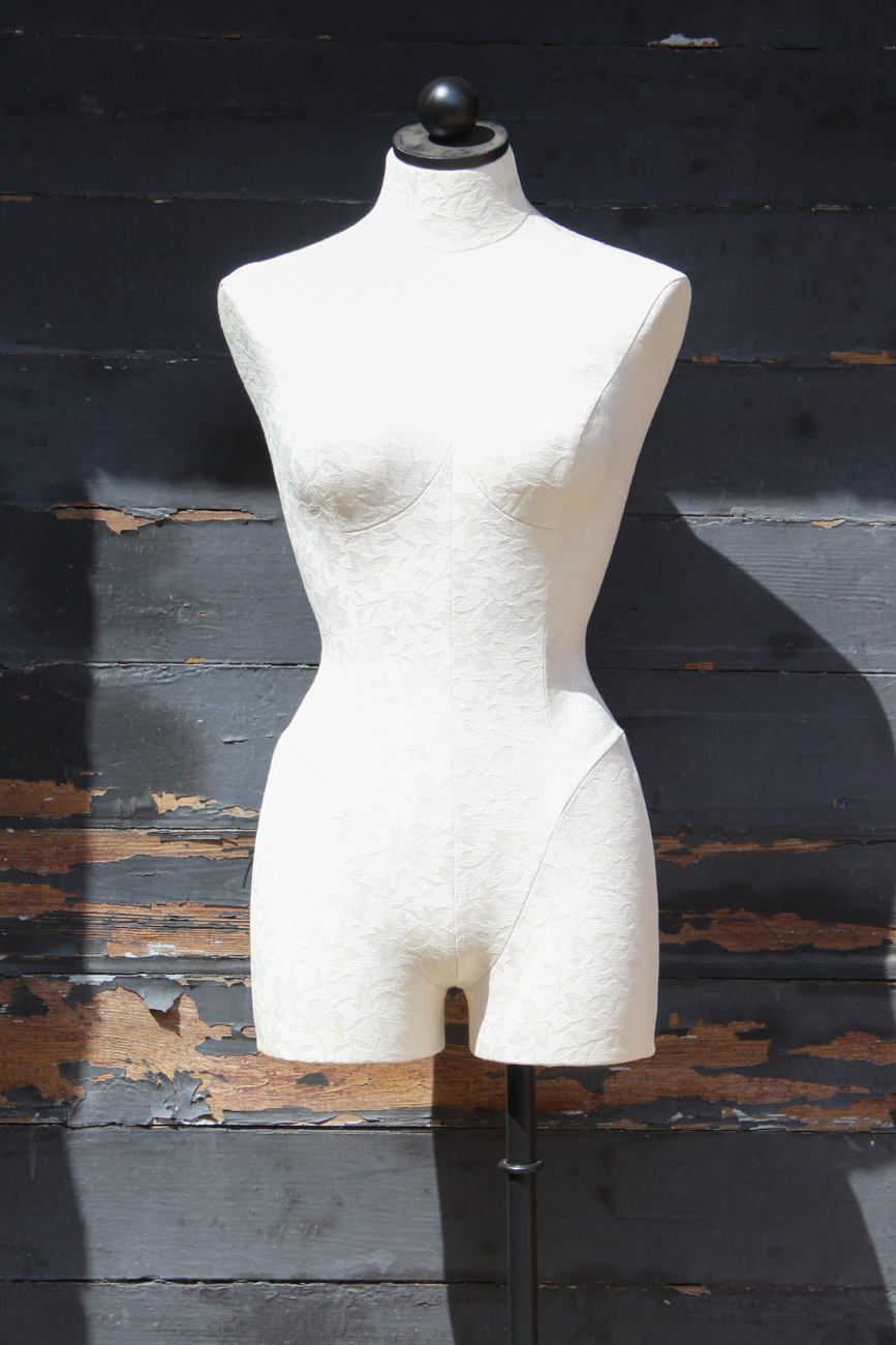 White Upholstered Dress Form On Wrought Iron Stand