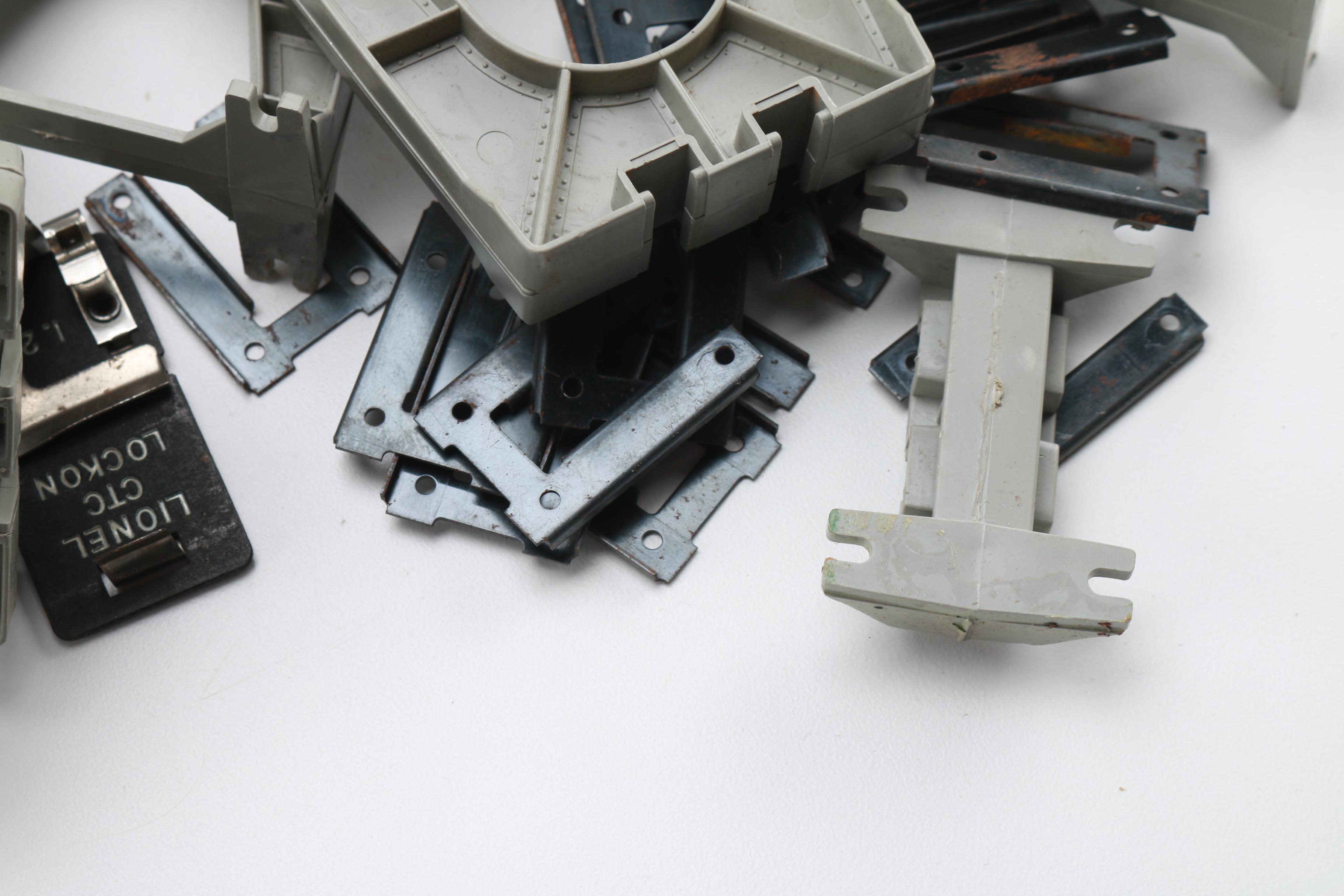 Assortment of Lionel Train Cars and Parts