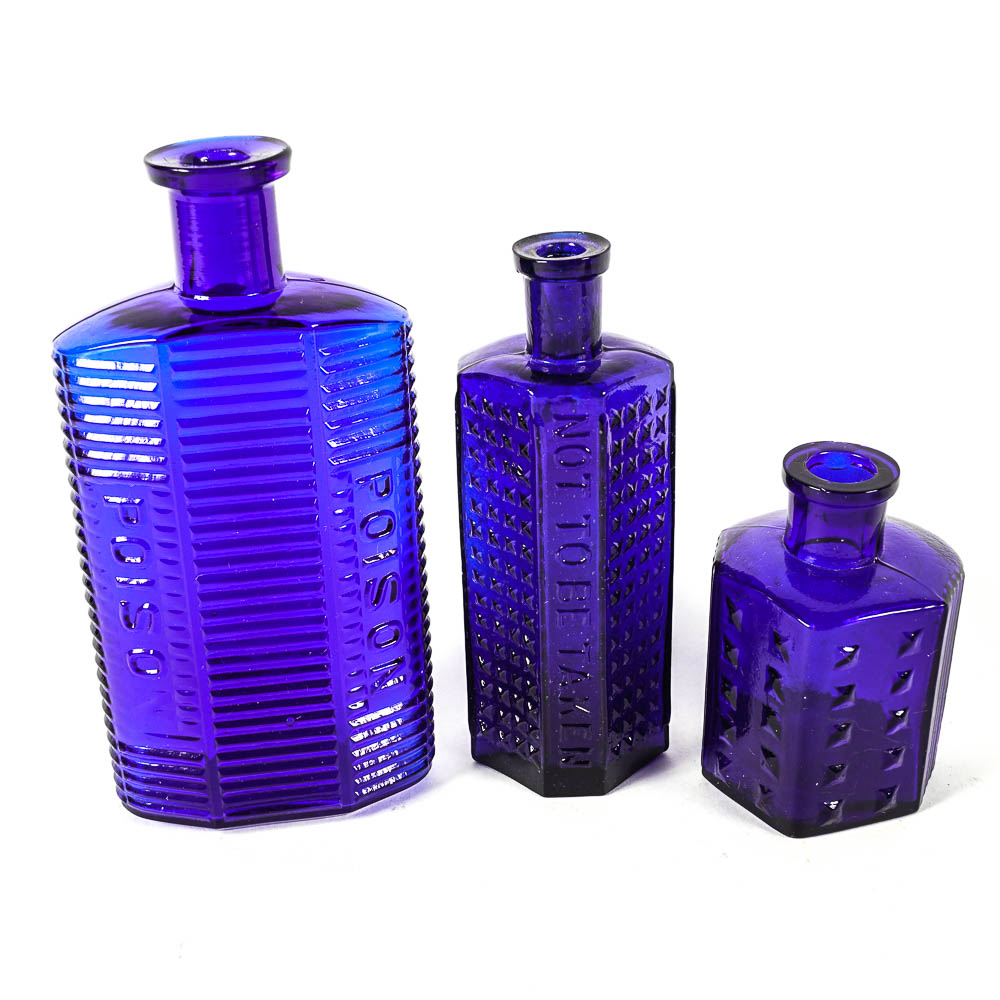Set of Three Antique Blue Glass Bottles