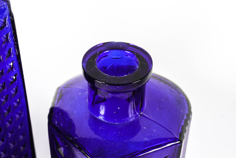 Set of Three Antique Blue Glass Bottles