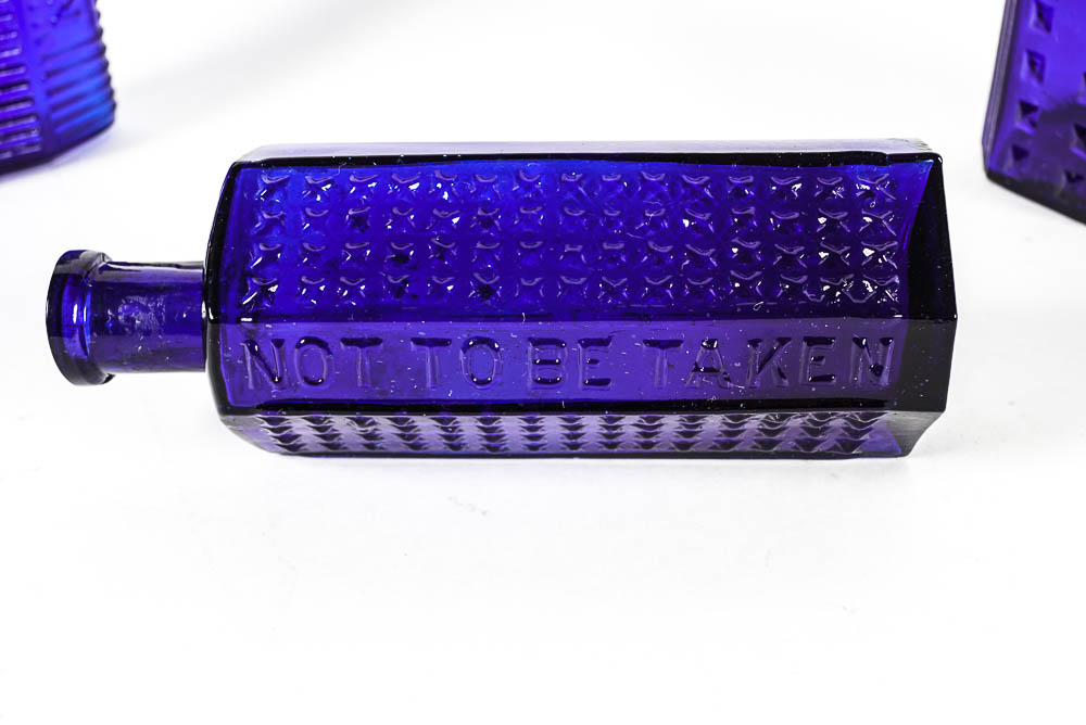 Set of Three Antique Blue Glass Bottles